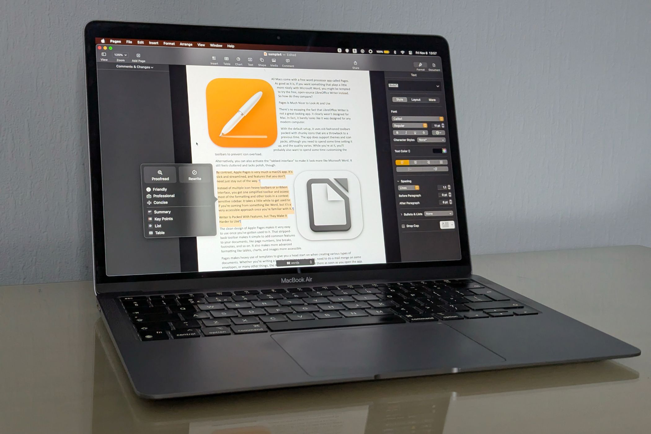 A MacBook Air showing the Pages and LibreOffice icons on screen.