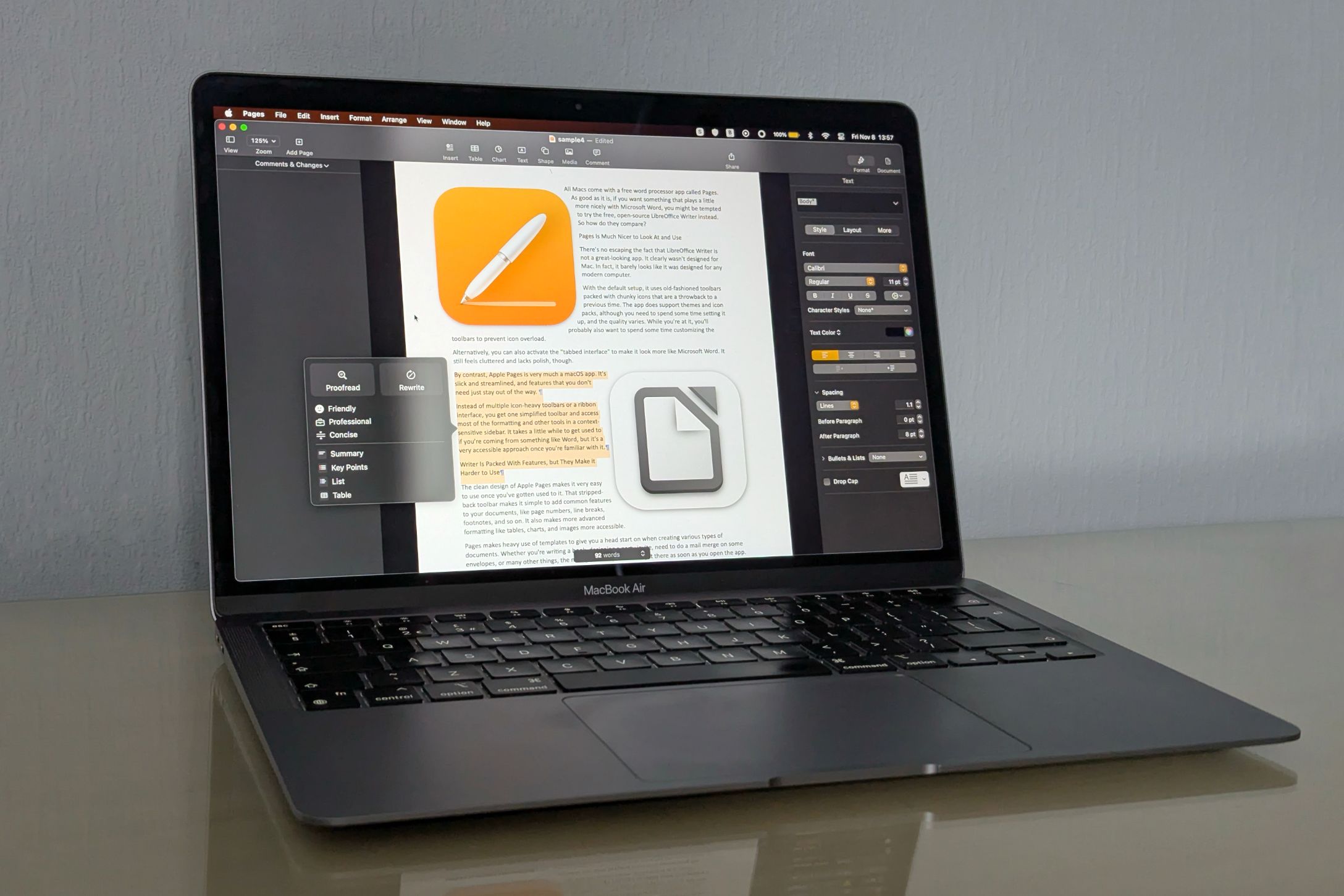 A MacBook Air with the Pages and LibreOffice icons on screen.