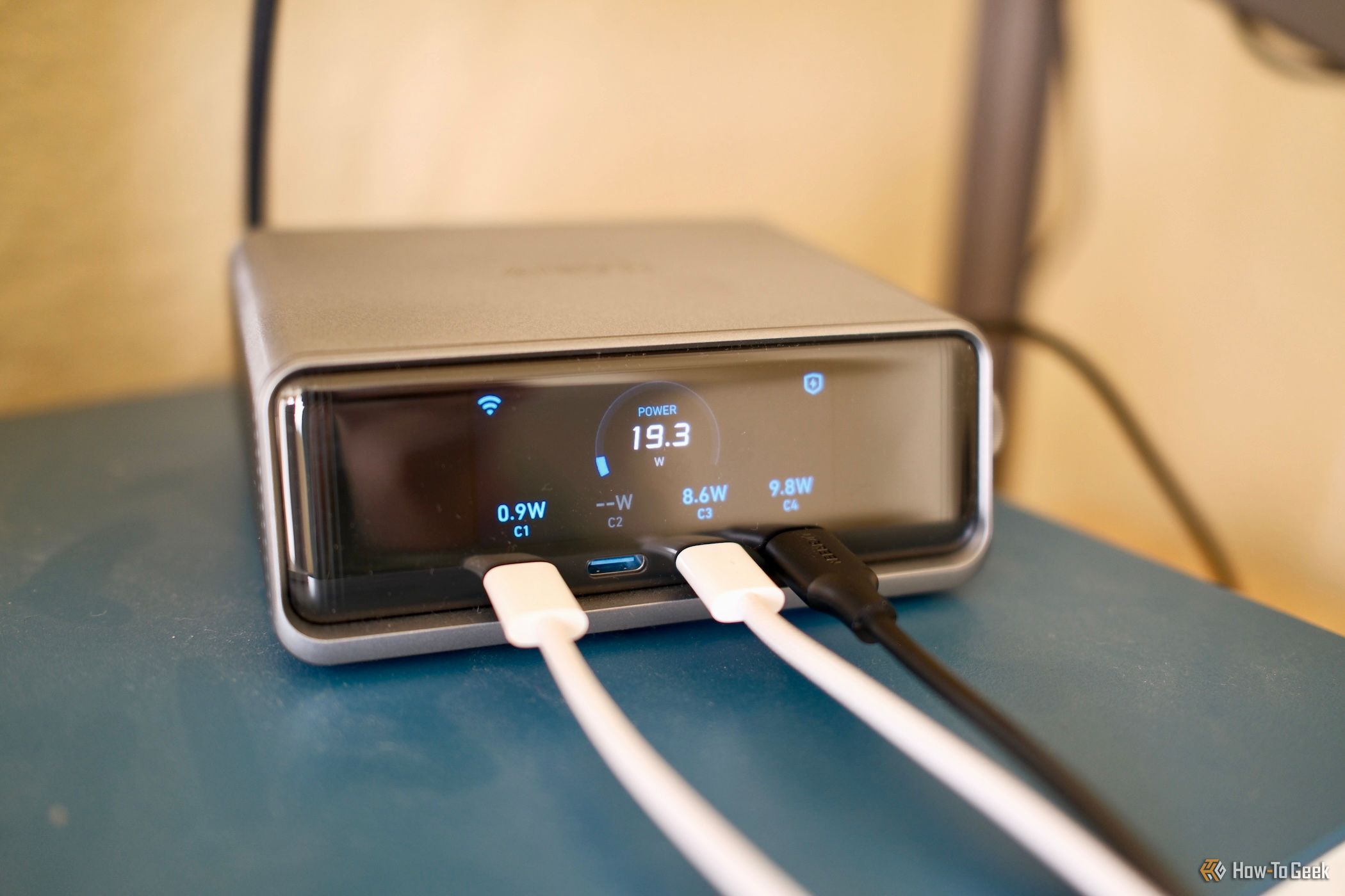 Anker Prime Charger 250W  showing devices charging power on the screen