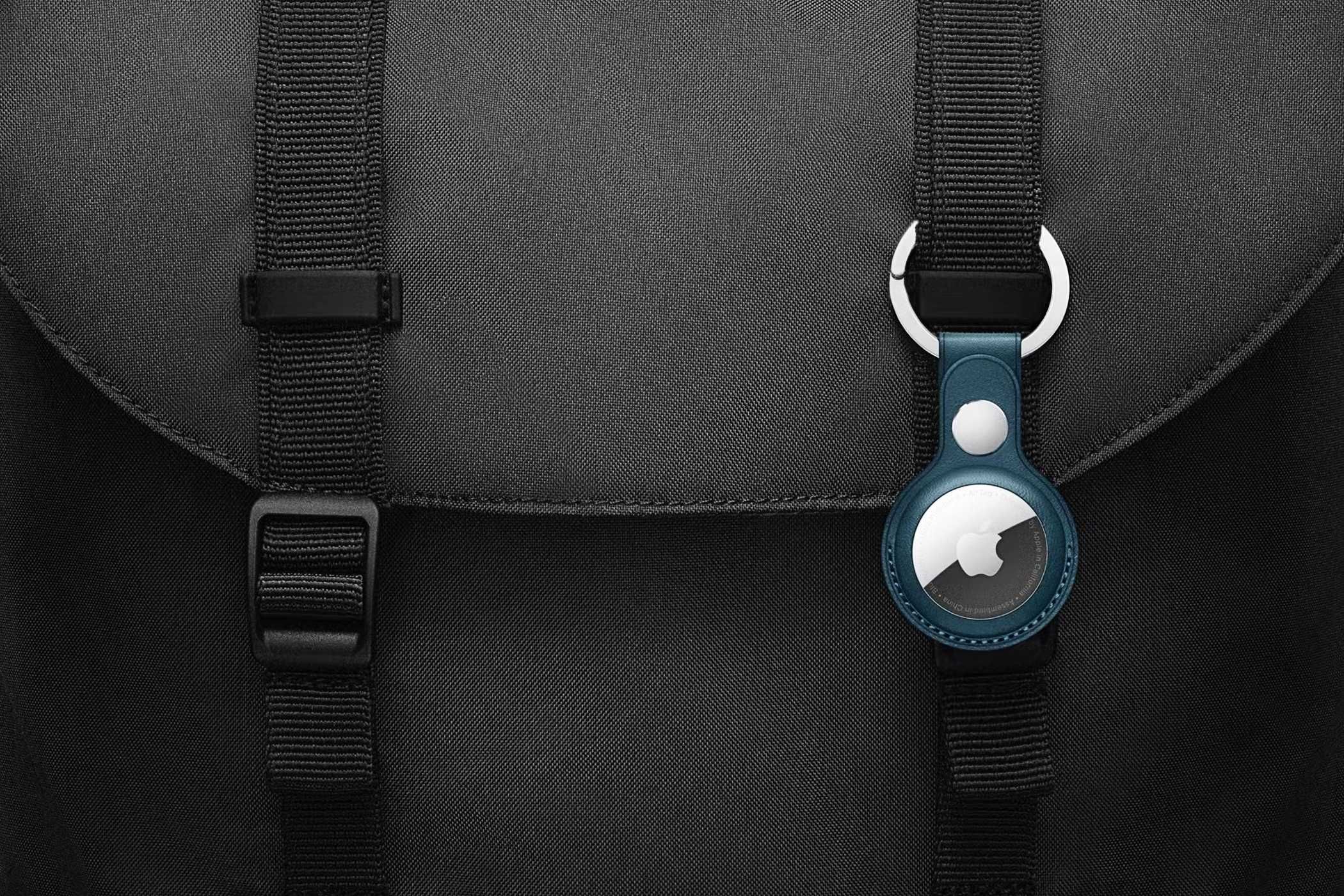 Apple AirTag on a black backpack