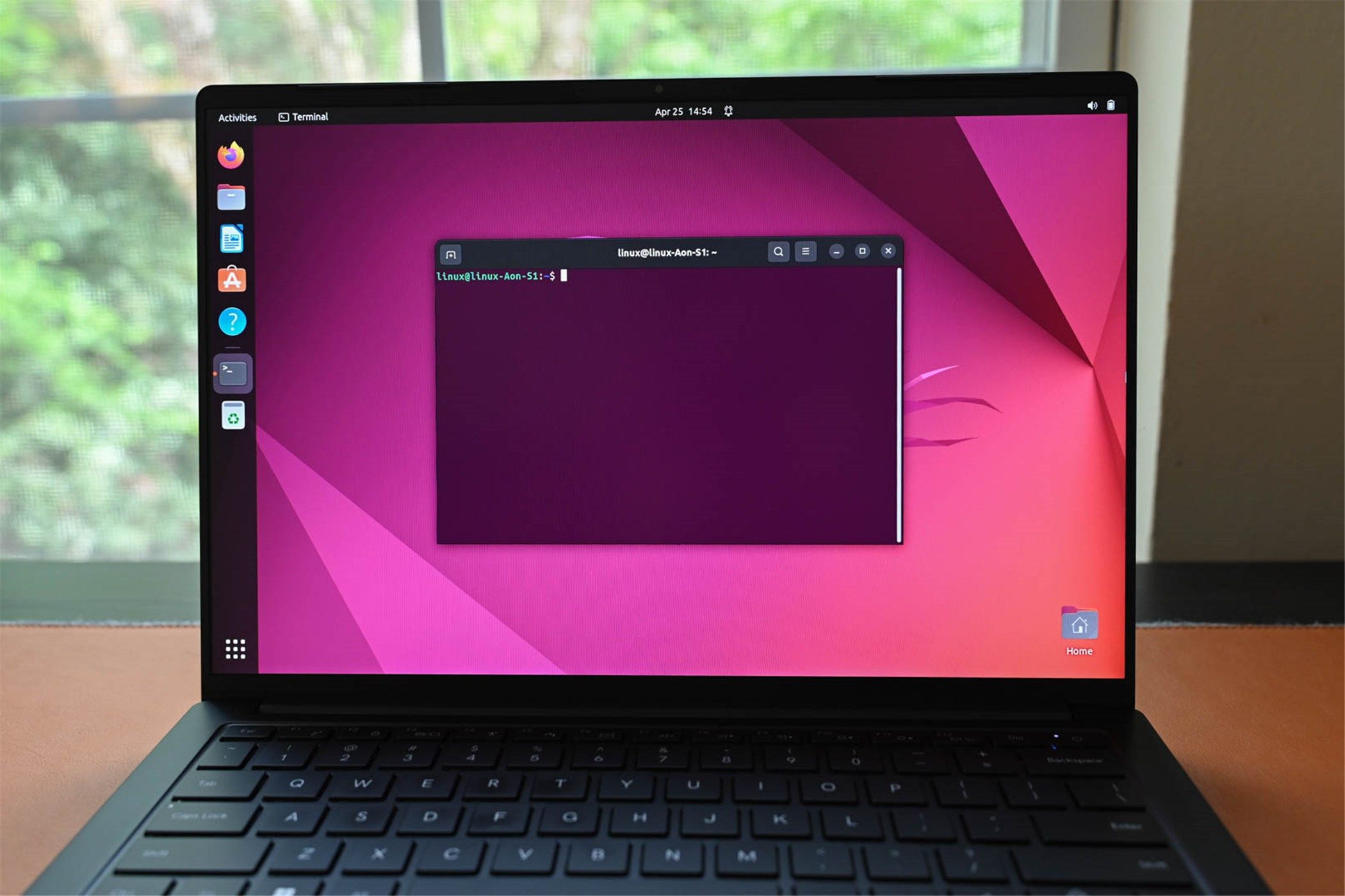 A laptop running Ubuntu with a Linux Terminal open.