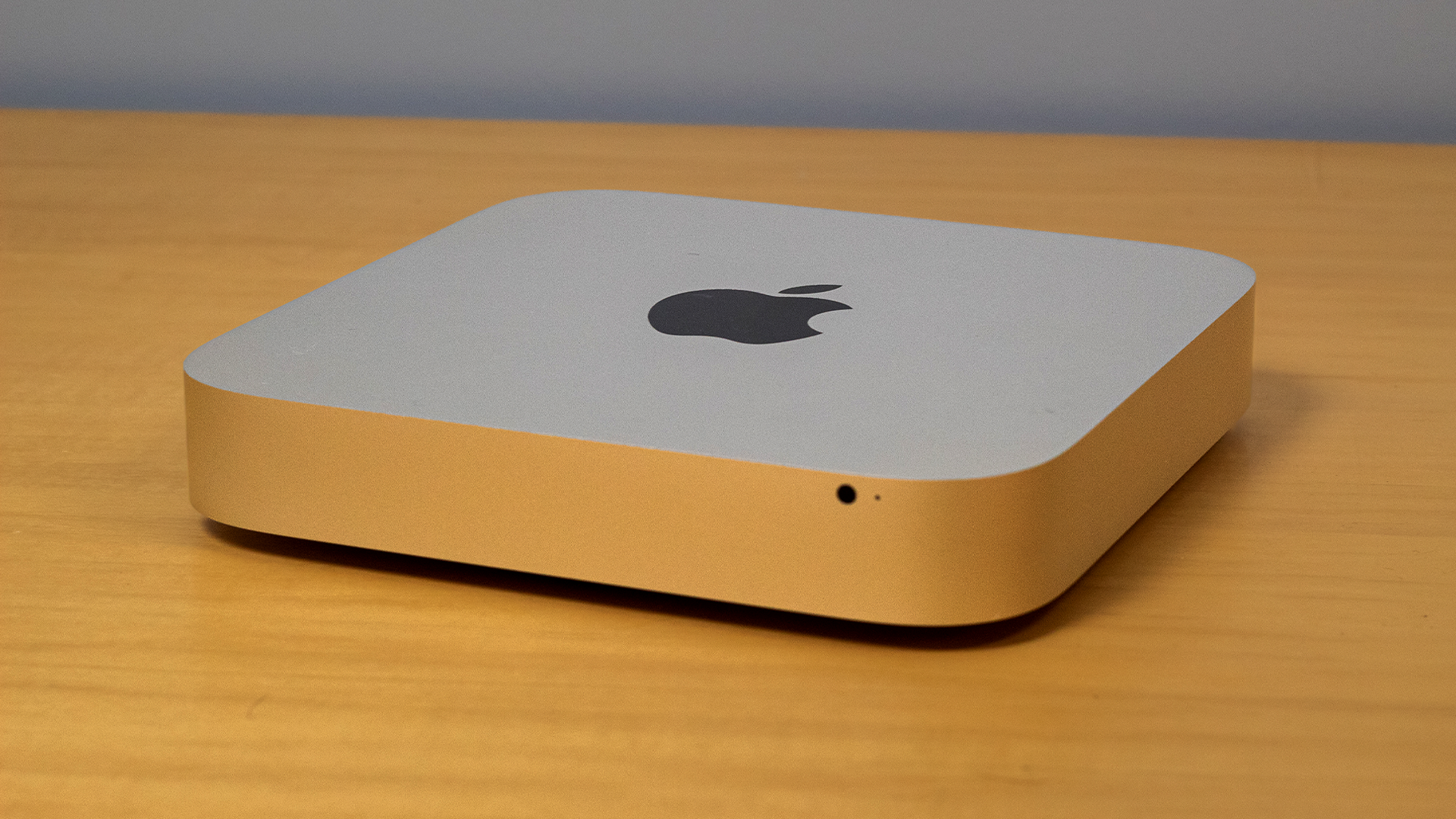 A Mac Mini sitting on a table.