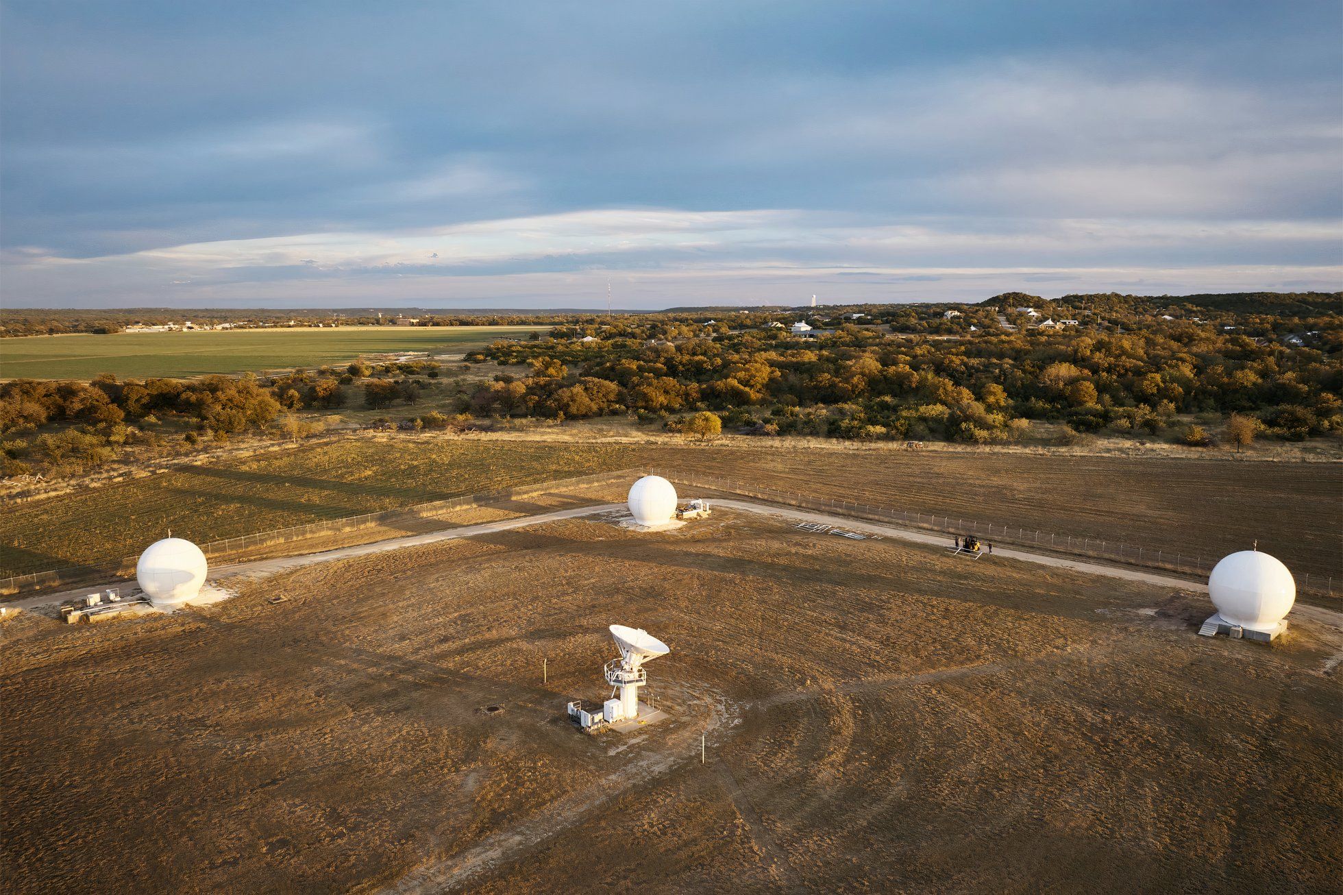 An aerial view of a Globalstar ground station field.