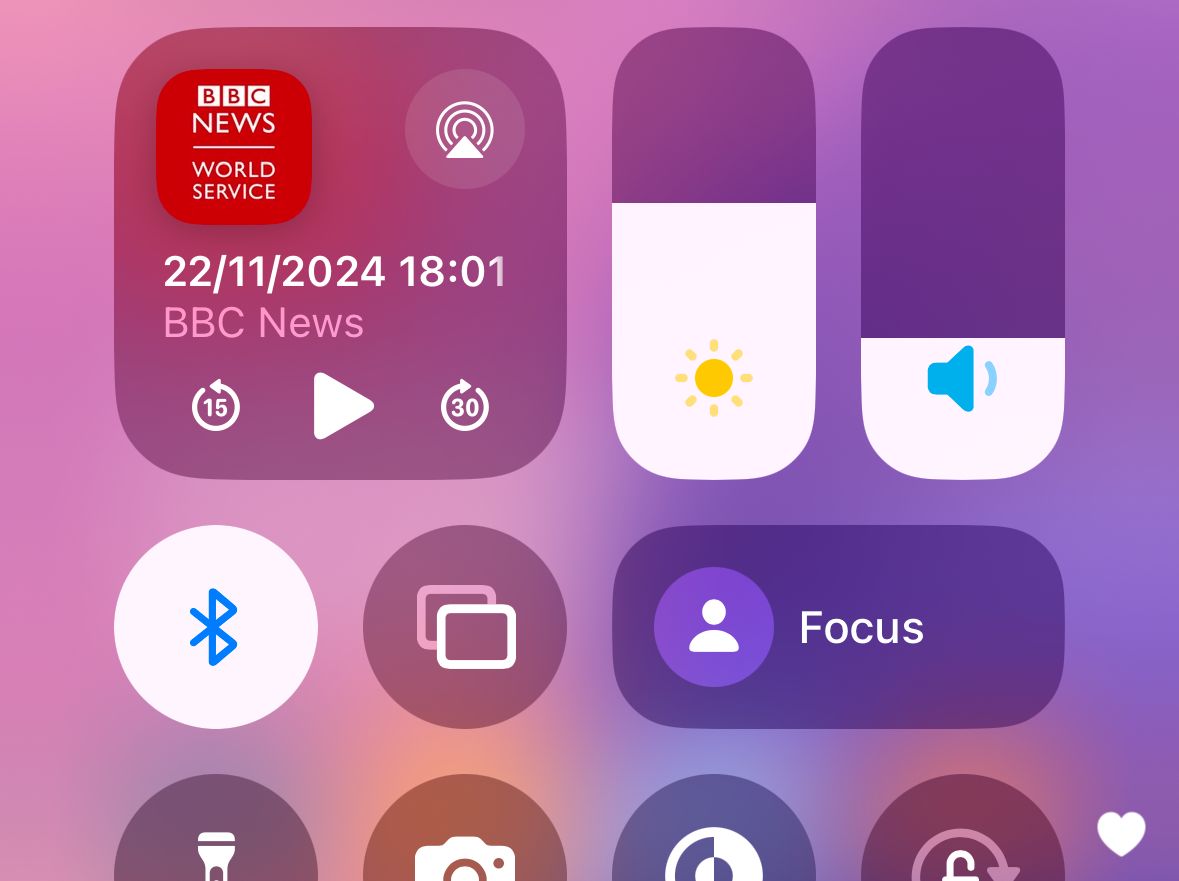 The Control Center on an iPhone, with toggles for screen brightness, volume, and more.