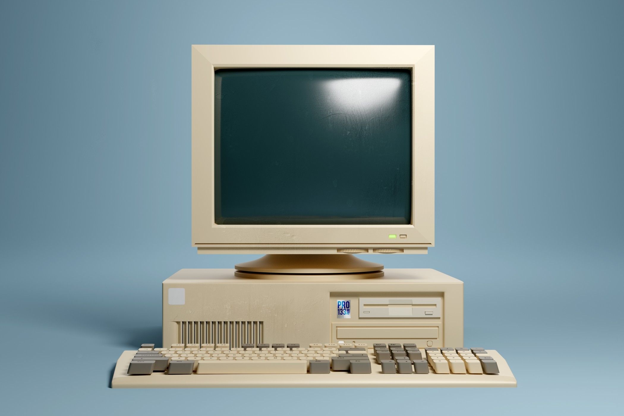 Retro 1990s style beige desktop PC computer and monitor screen and keyboard.