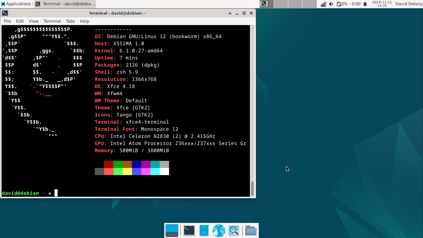 Xfce Debin desktop with neofetch in a terminal window running on an old ASUS laptop.