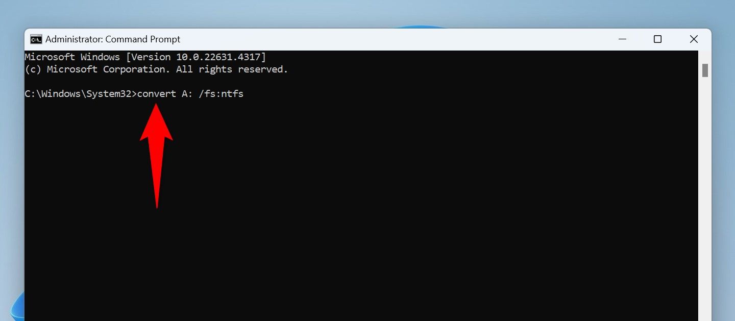 The command to convert a drive to NTFS typed in Command Prompt.