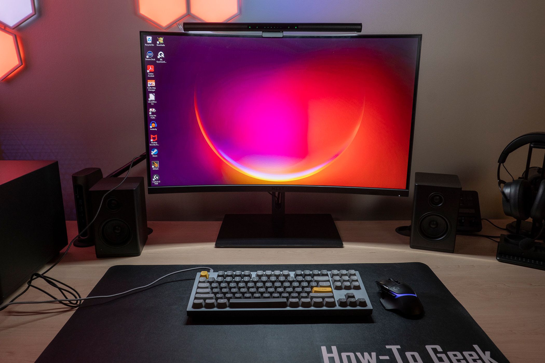 The Razer Aether Monitor Light Bar lighting up a desk.