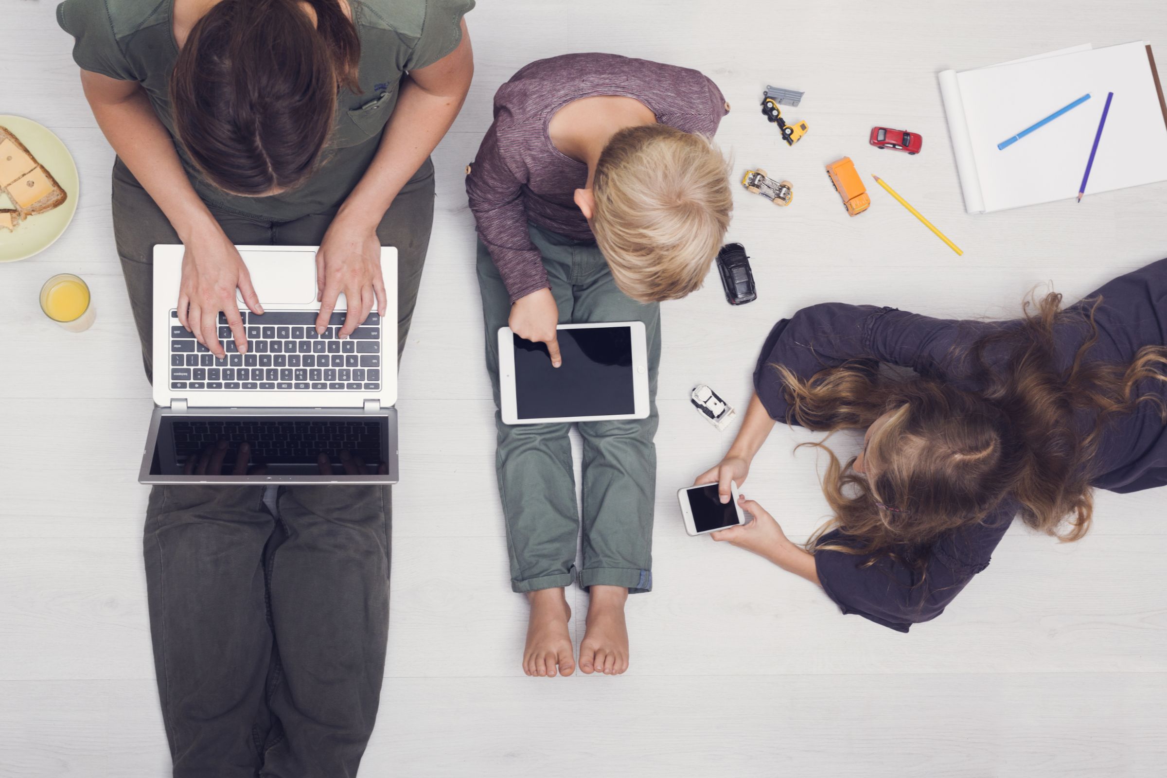 A family using a variety of Apple devices.