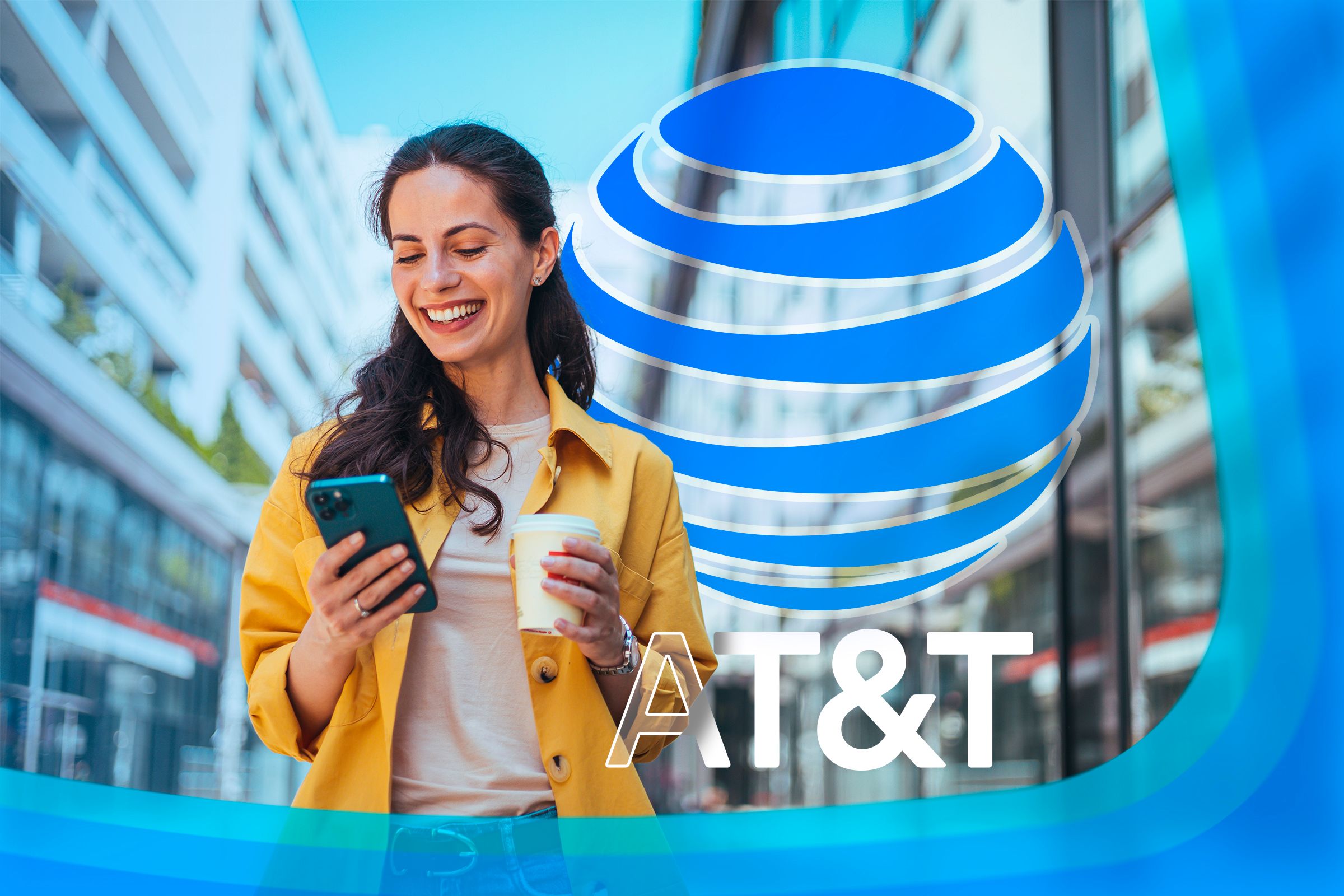 A happy woman using her phone with the AT&T logo next to her.