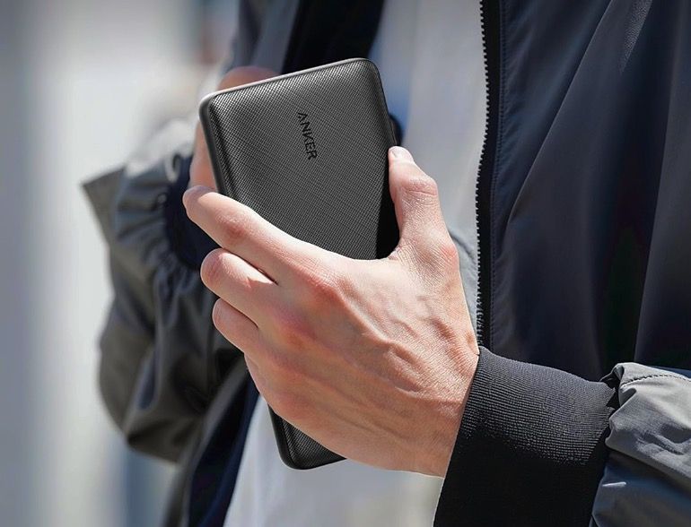 A man holding a Anker 325 PowerCore Essential 20000.