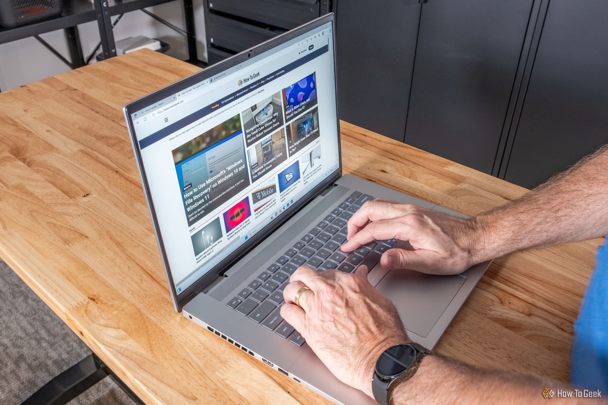 A person typing on a Dell Inspiron 16 Plus 7630 laptop.