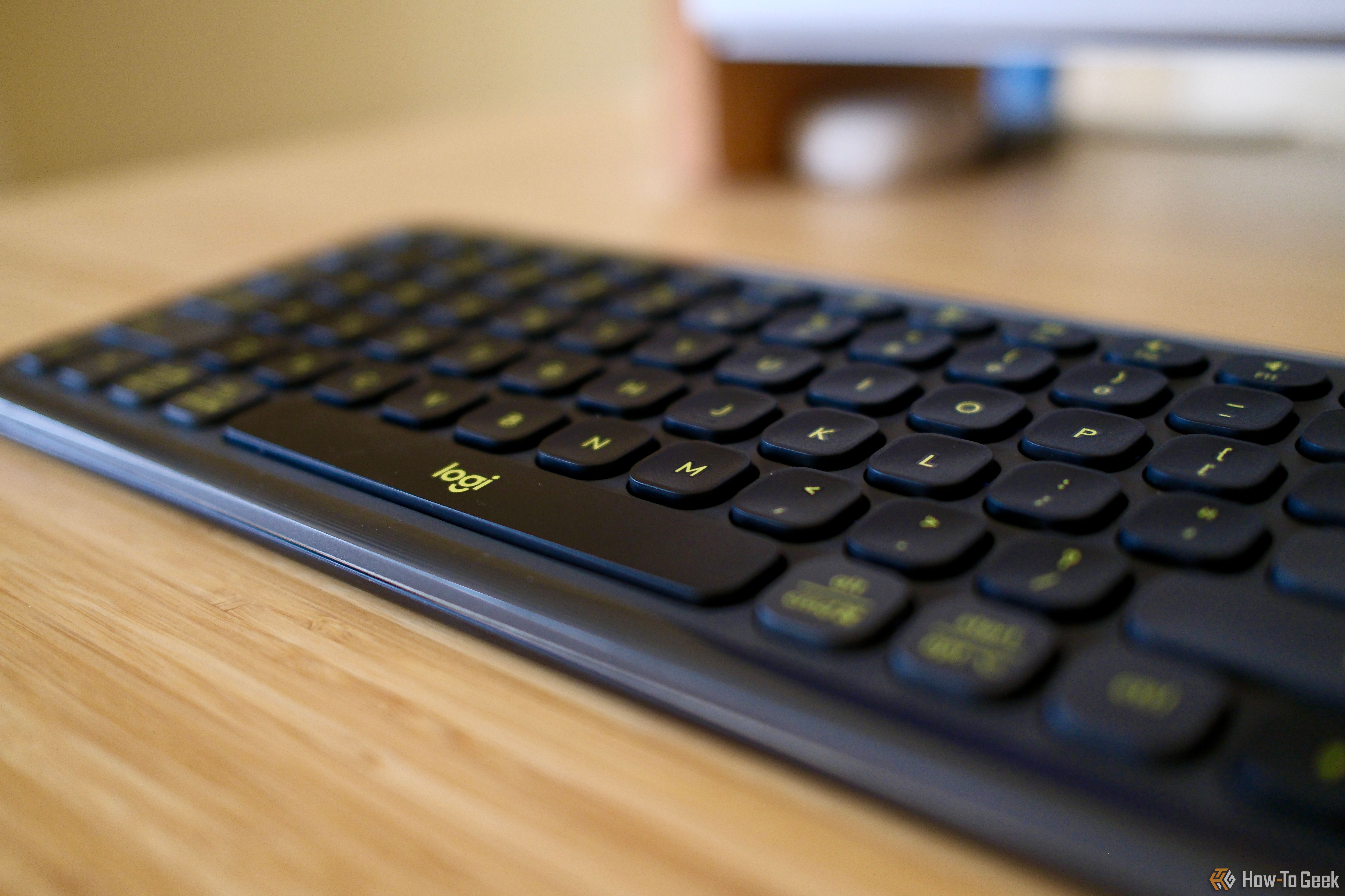 Side view of the Logitech Pop Icon Keys on a table focused on the spacebar.