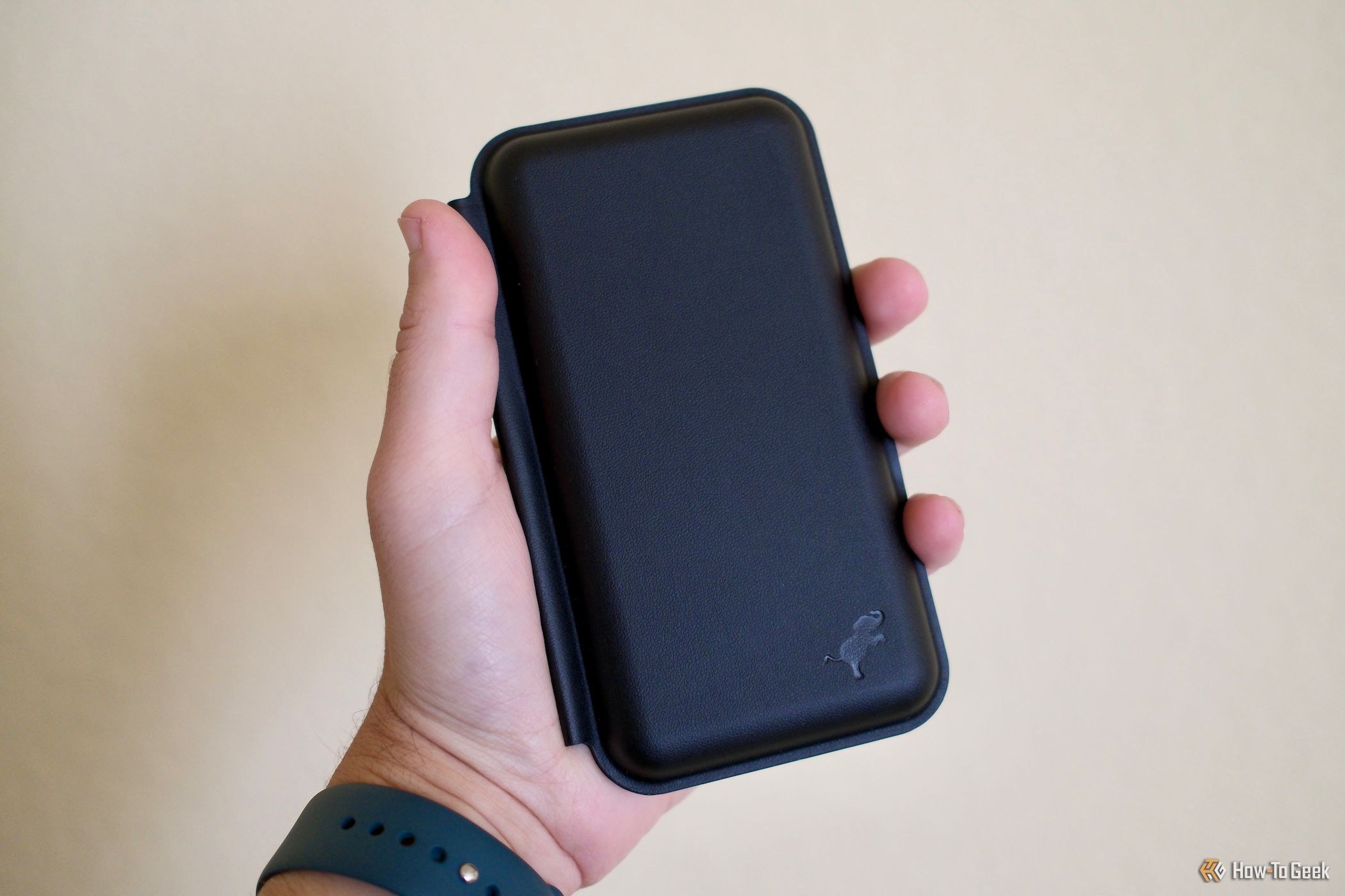 Nimble Fold 3-in-1 Wireless Charger closed being held in someone's hand