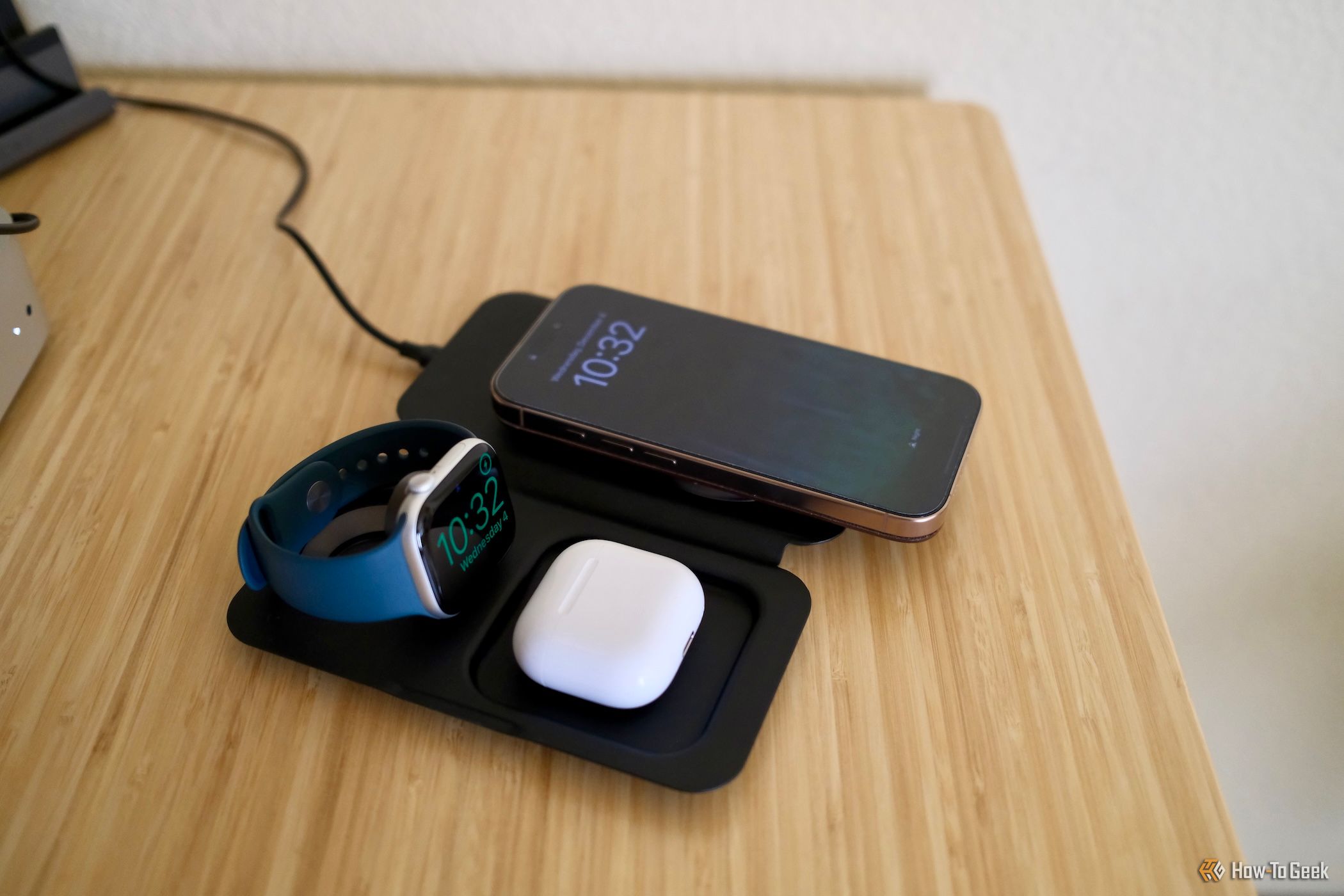 Nimble Fold 3-in-1 Wireless Charger open charging a watch, earbuds, and phone