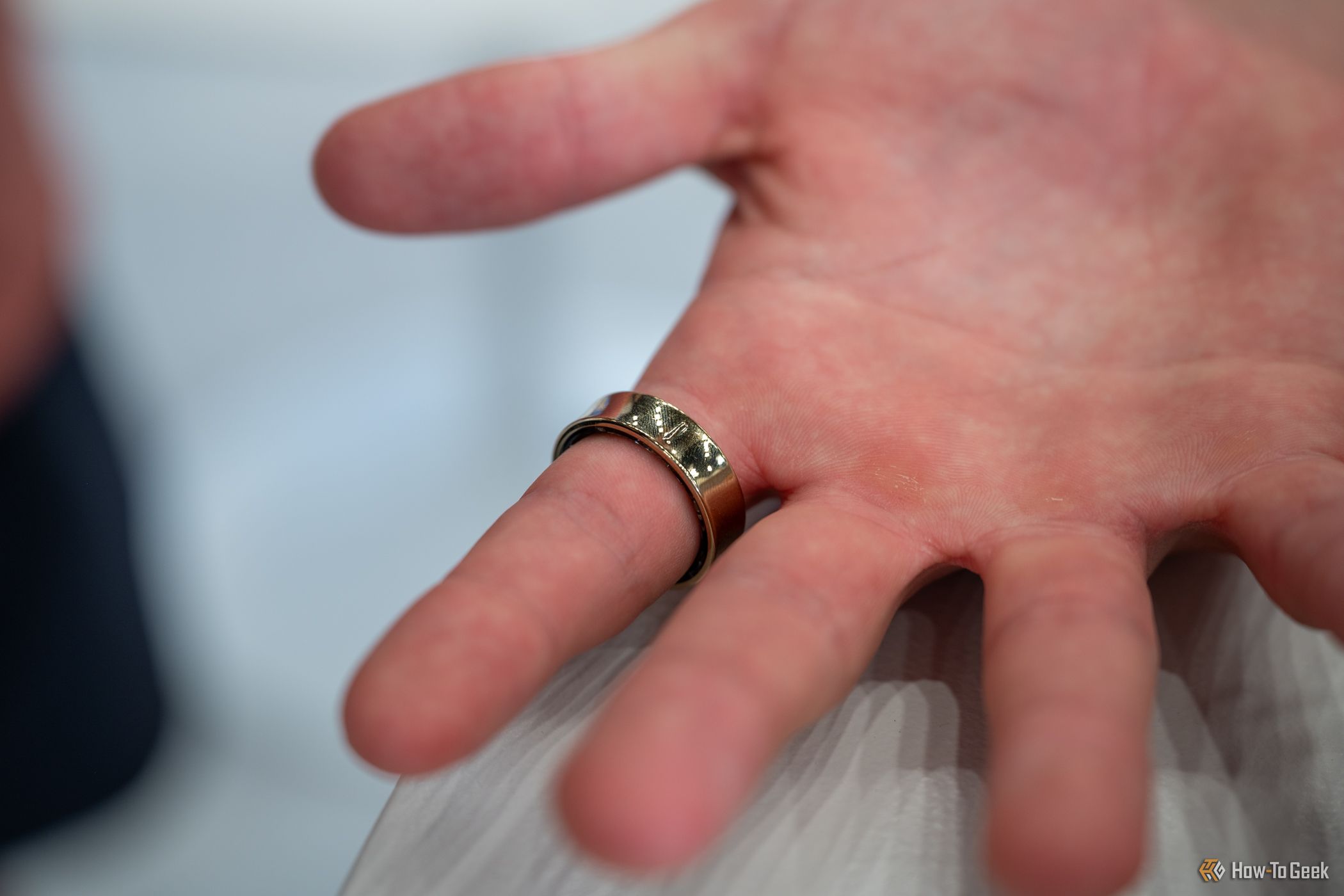 Person wearing the Samsung Galaxy Ring showing the bottom notch