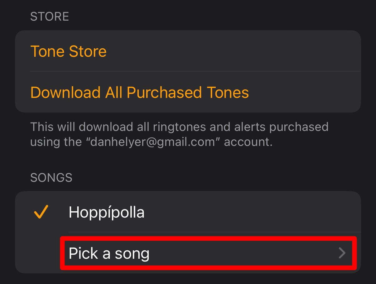 'Pick a song' option in iPhone alarm settings.