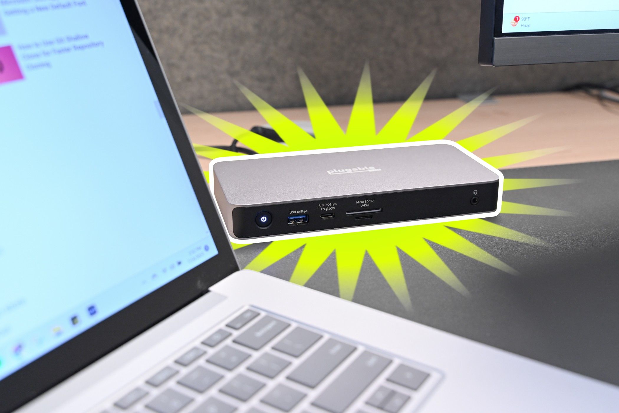 The Plugable USB4 Dual HDMI Docking Station set up with a laptop and monitor