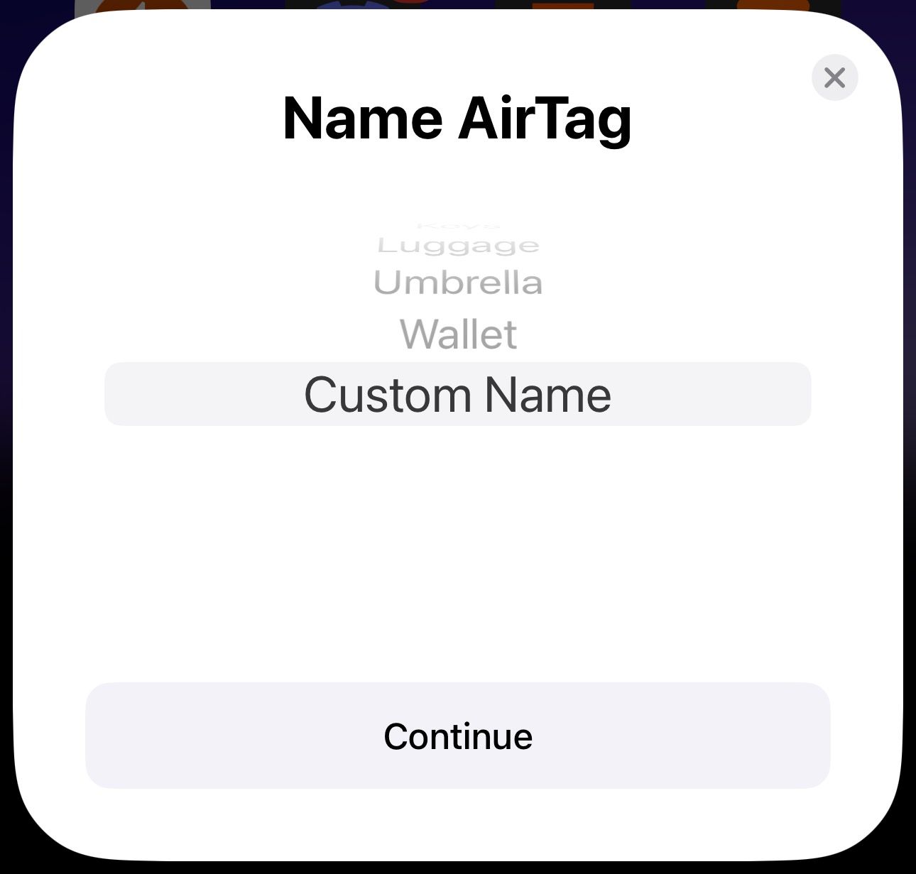 Custom Name option in the Name Airtag pop-up card on an iPhone.