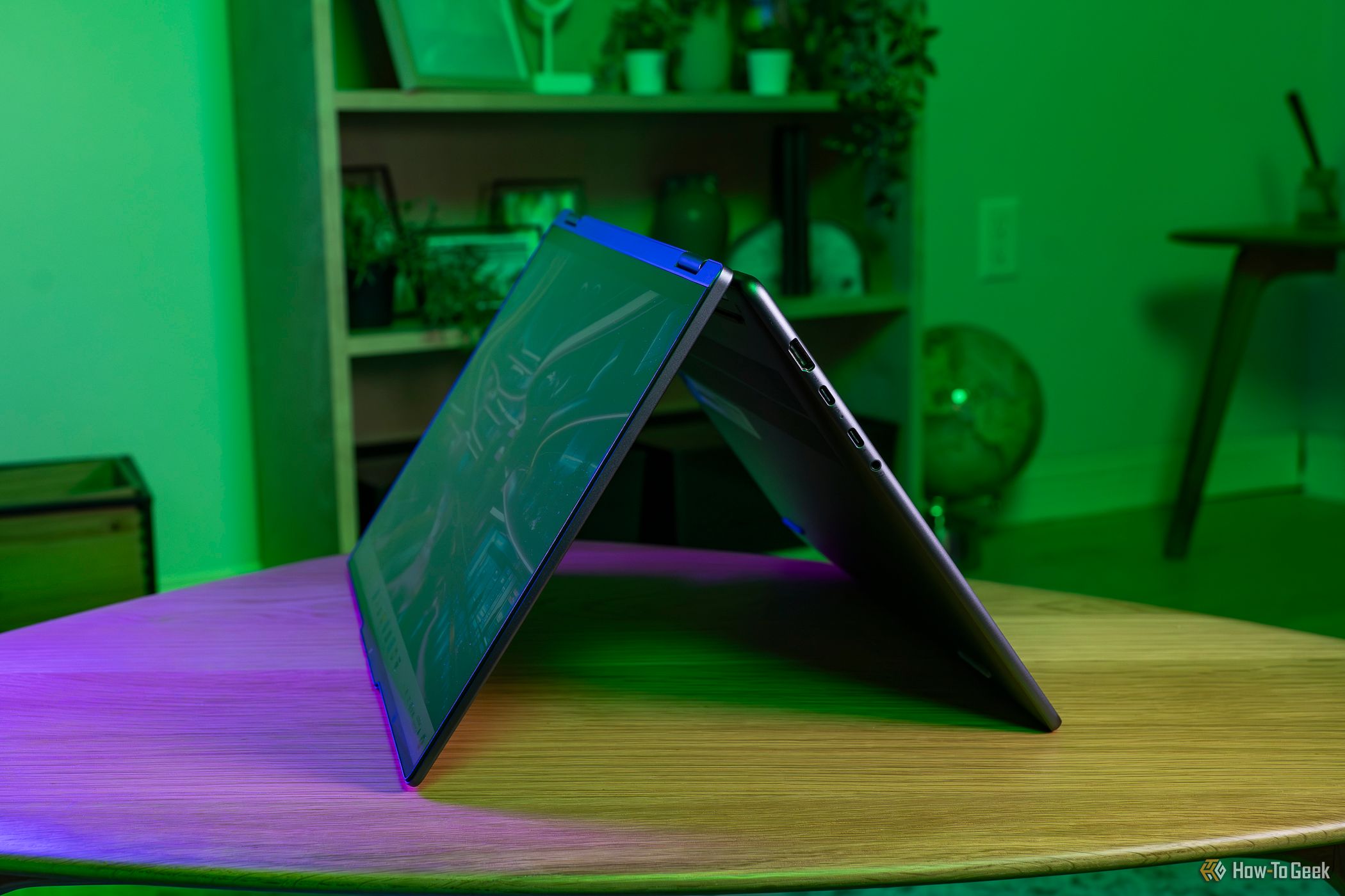 The Lenovo Yoga 7i 2-in-1 16 folded on a table.