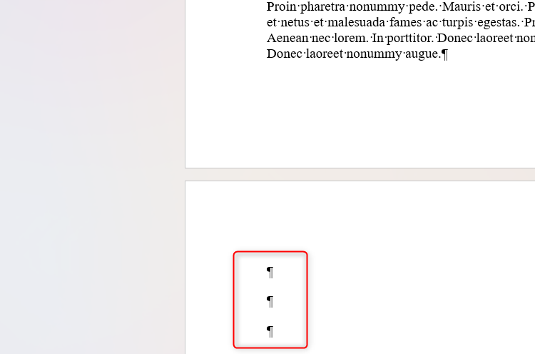 Three paragraph markers at the start of a new page in Microsoft Word.