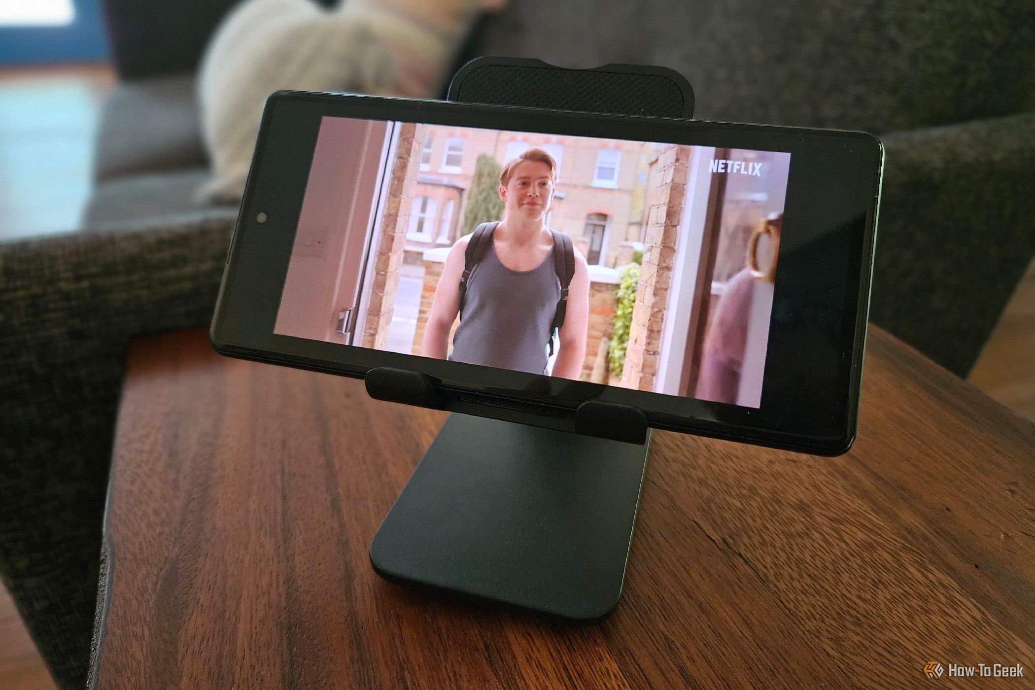 Phone on a stand playing a Netflix video