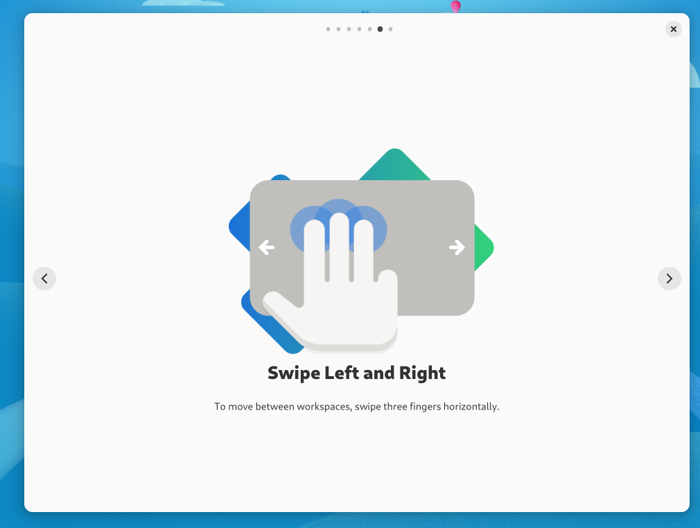 GNOME Tour app showing how to switch virtual desktops with touchpad guestures.