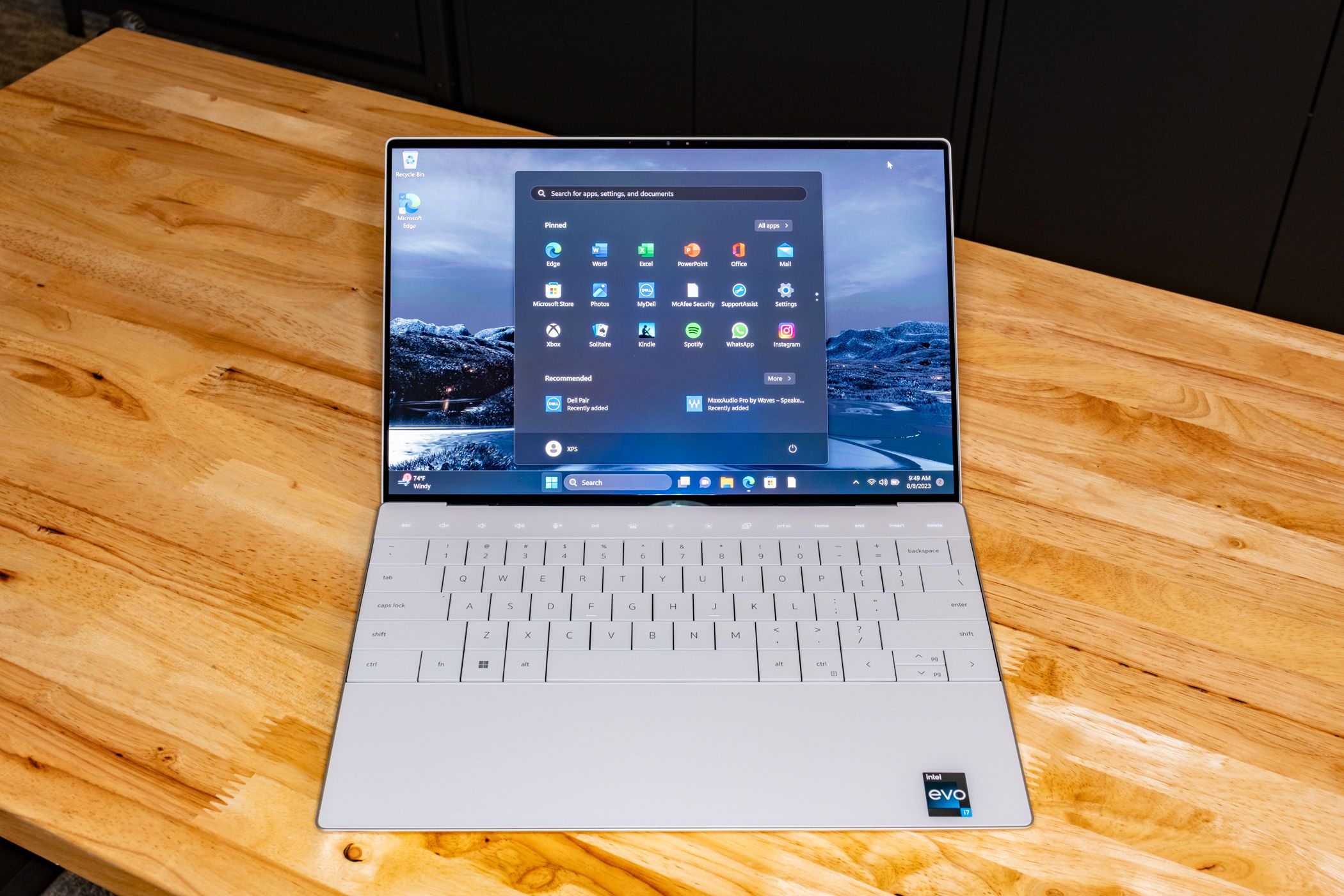 A Windows laptop placed on a wooden table.