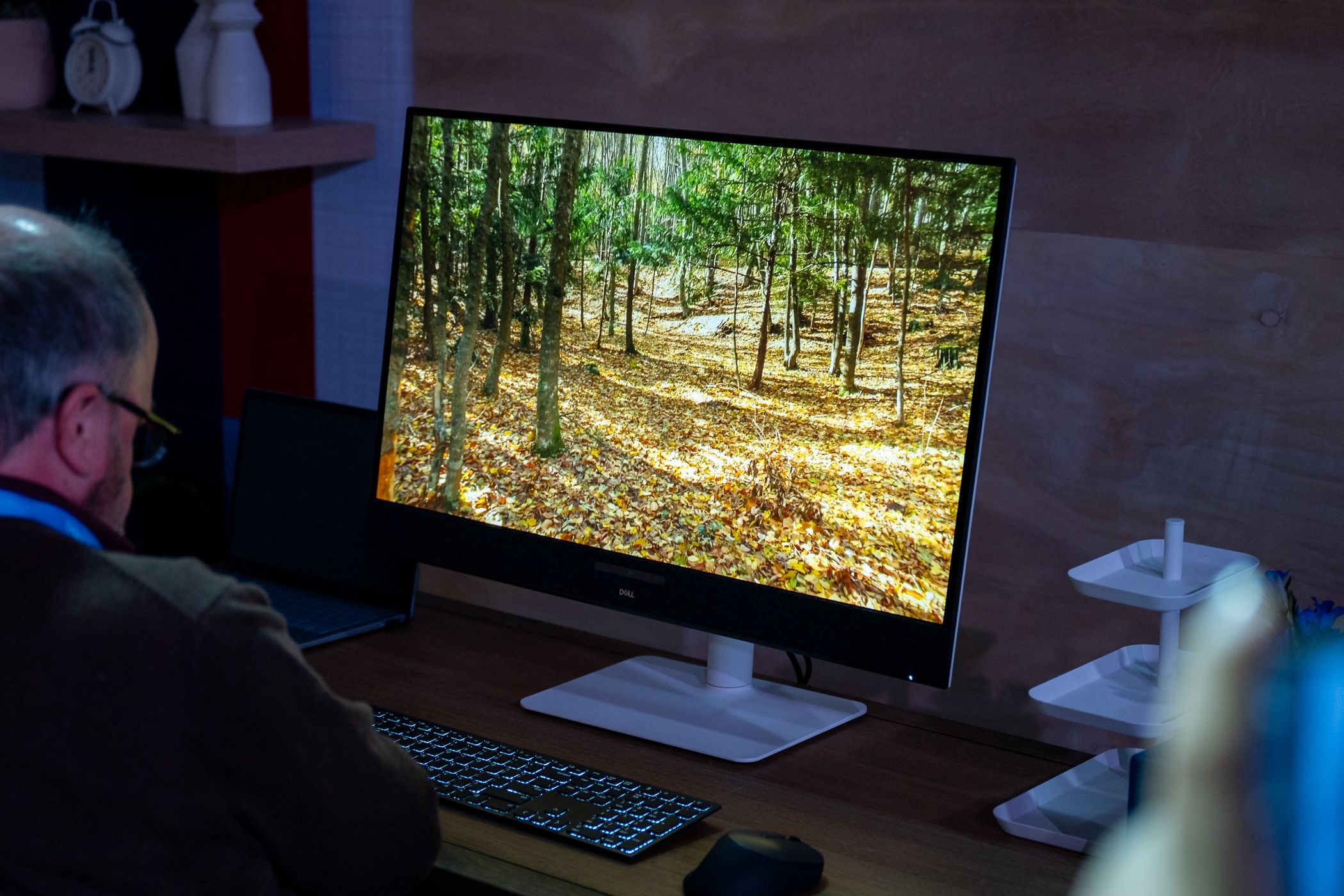 Dell 32 PLus 4K QD-OLED monitor sitting on a table playing a video.