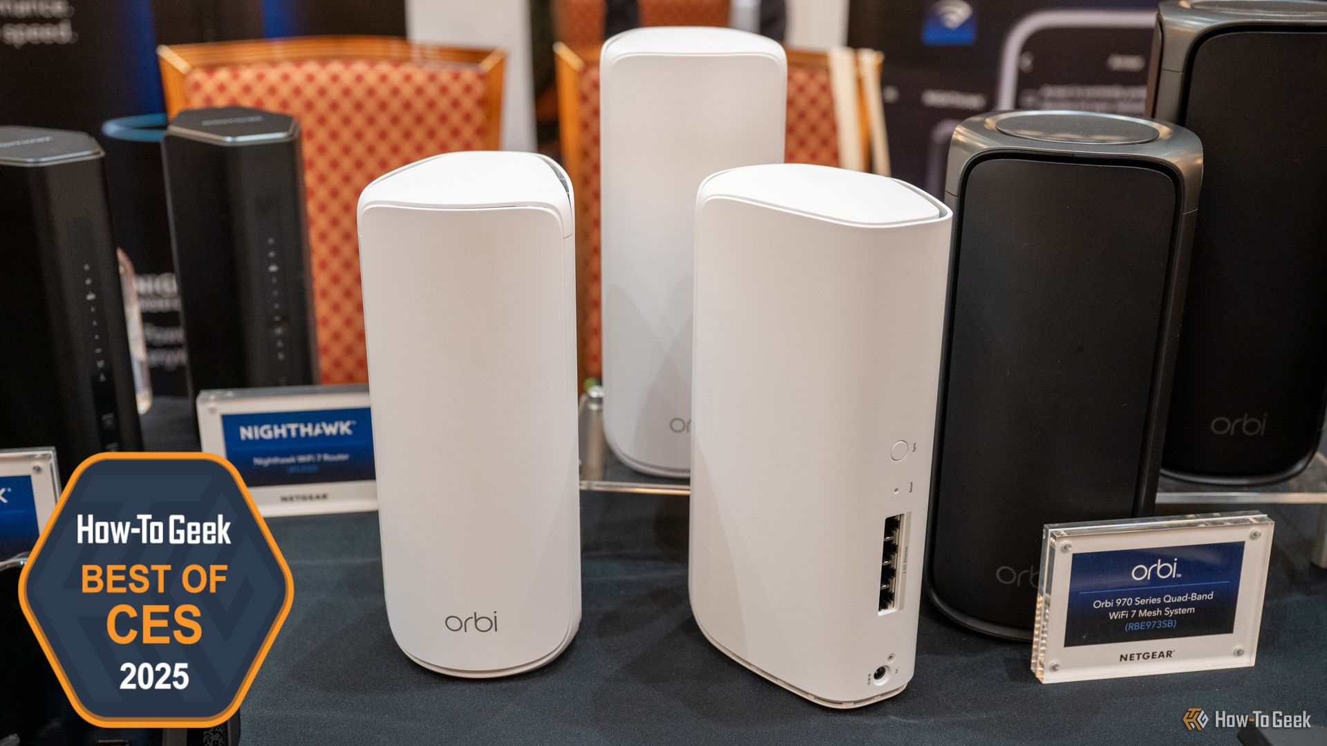 NETGEAR Orbi 870 Series Mesh Wi-Fi System sitting on a table.