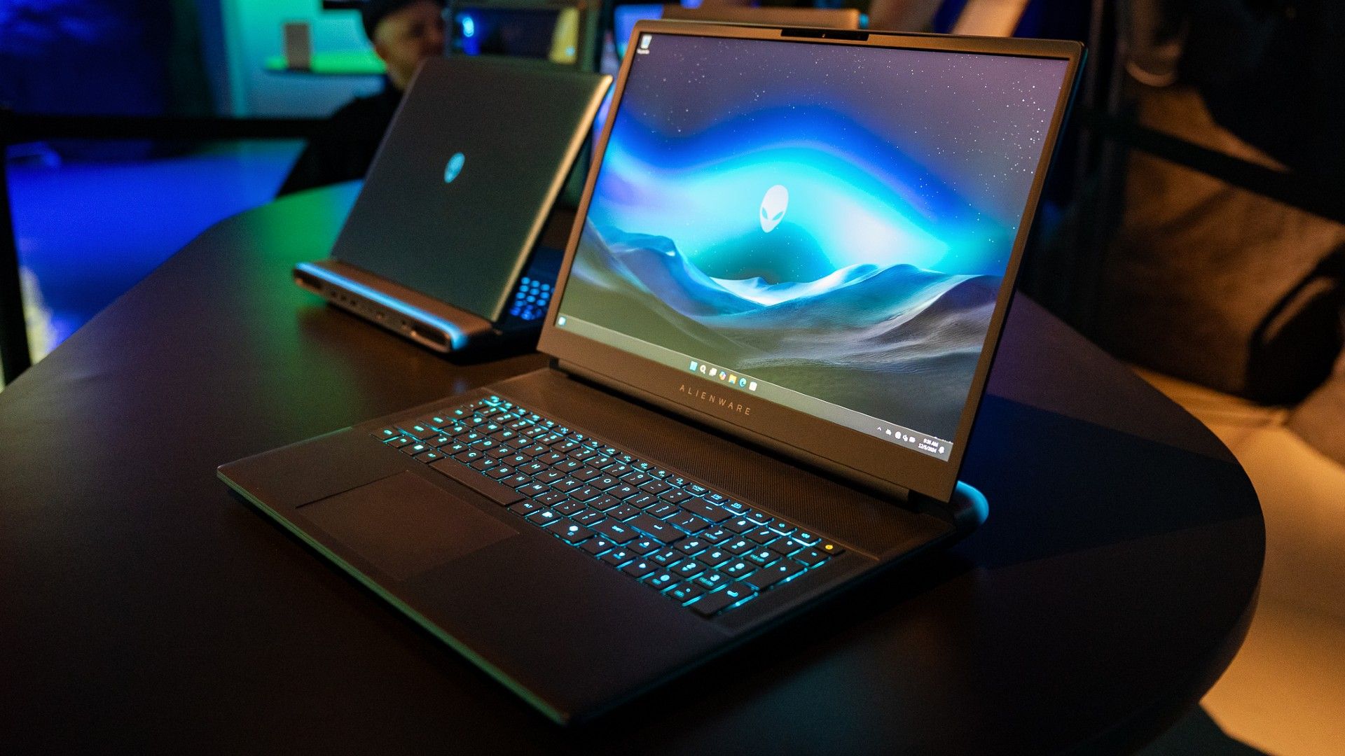 Alienware 18 Area-51 gaming laptop sitting on a table showing the display and keyboard