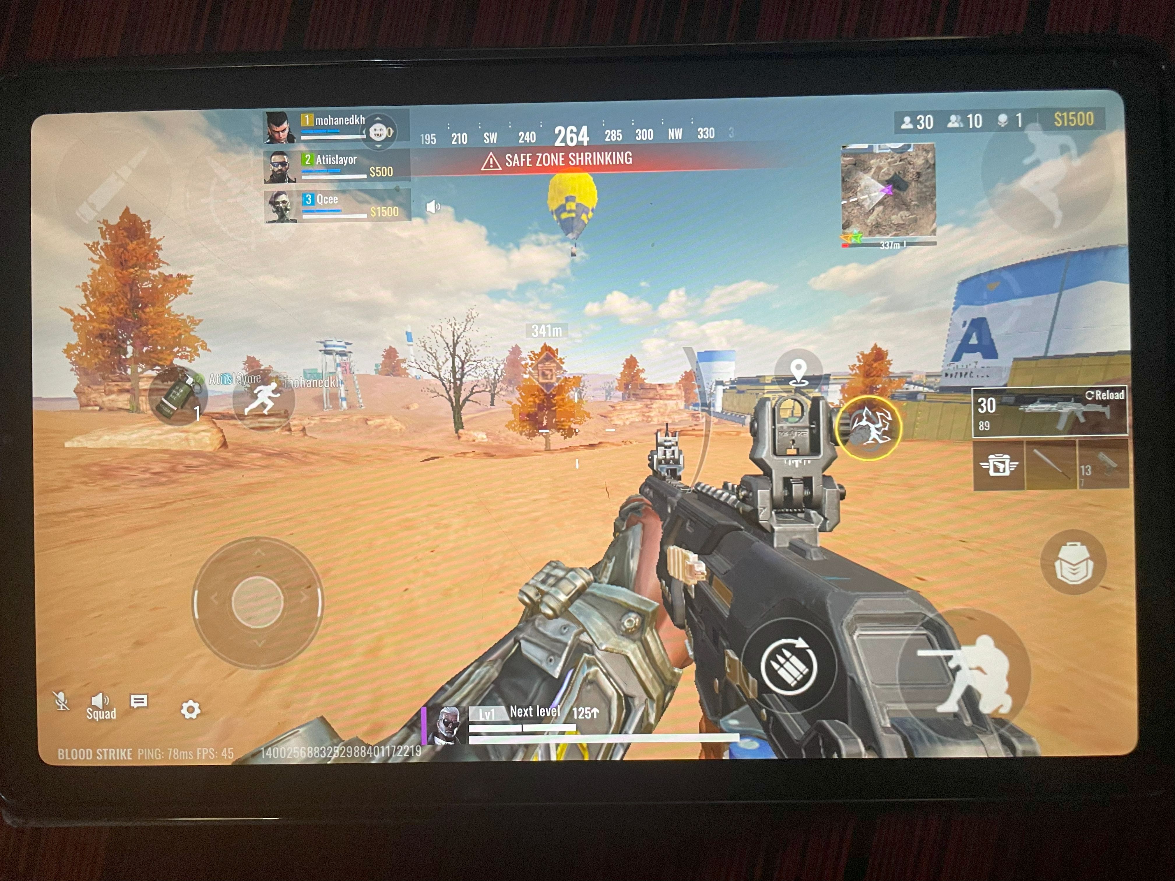 A picture of a "Blood Strike" match being played on an Android tablet.