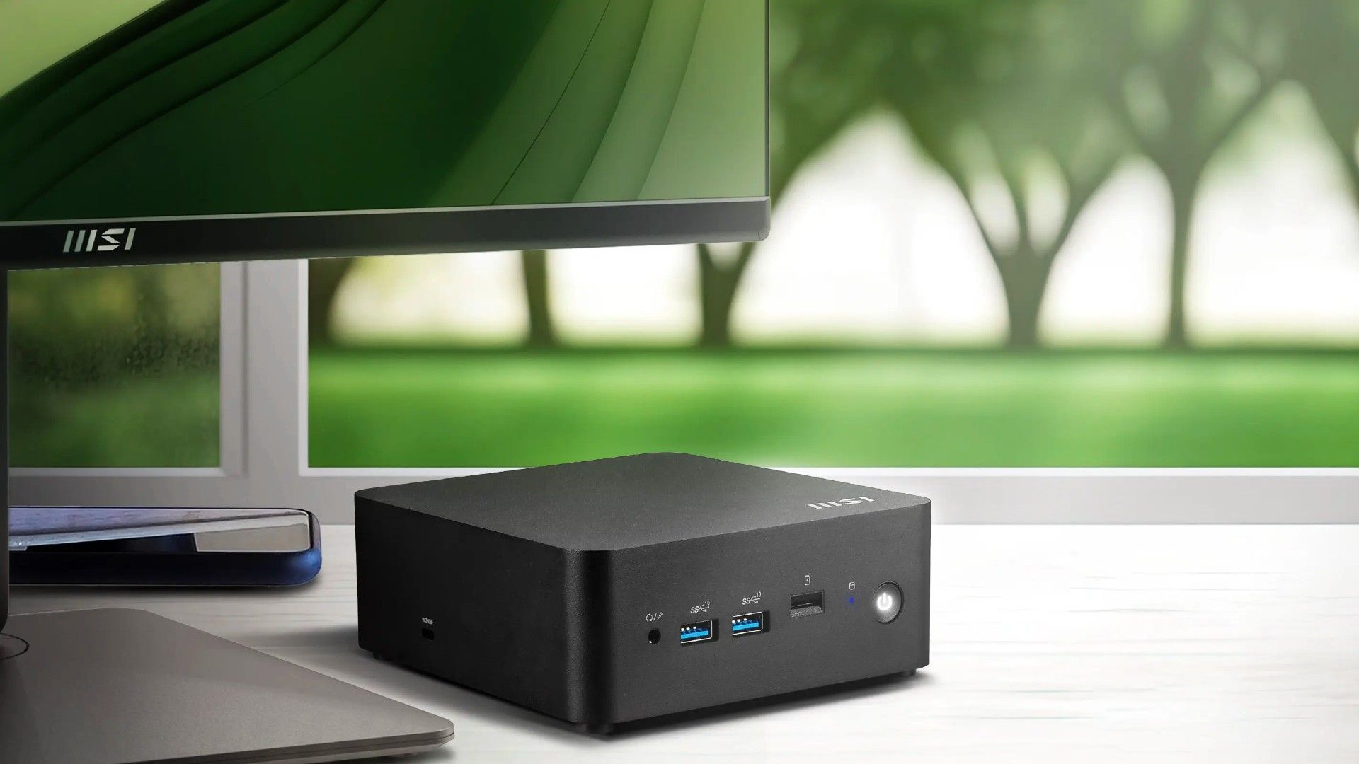 Cubi Nuc Series pc next to monitor