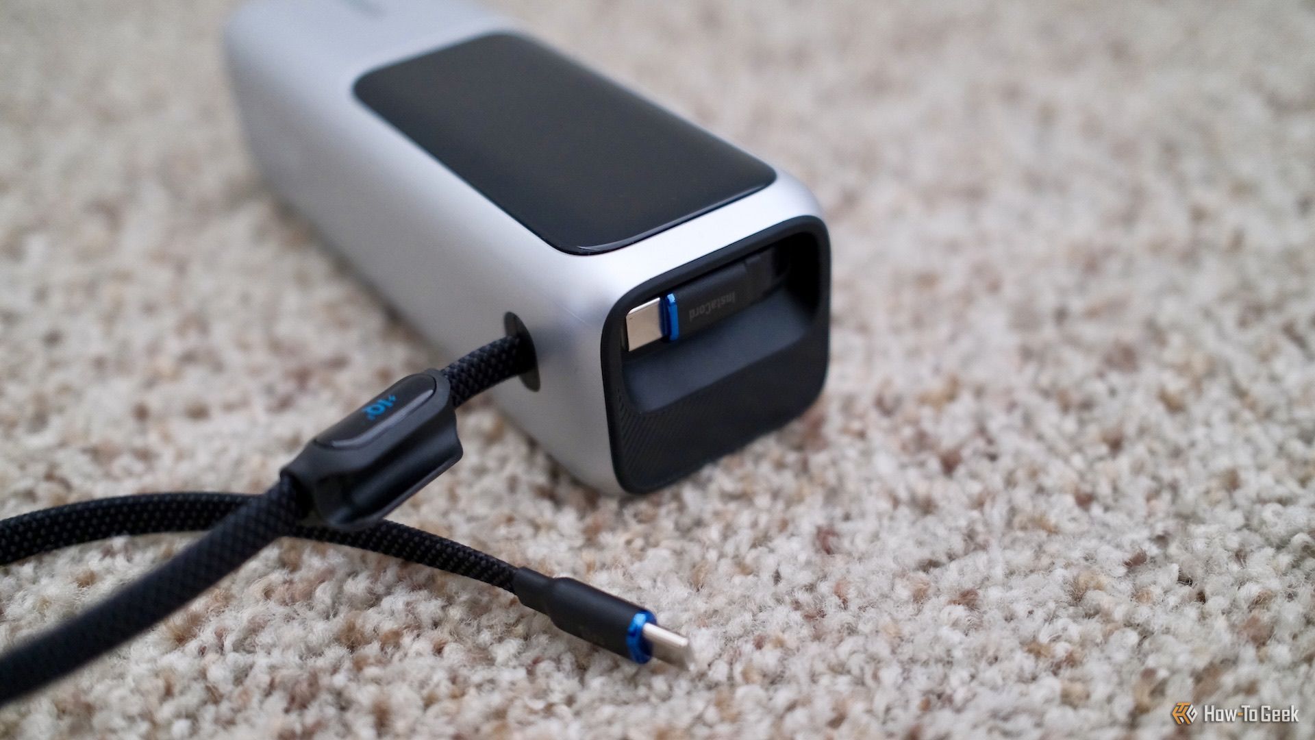 Anker Power Bank 25K showing both attached cables.