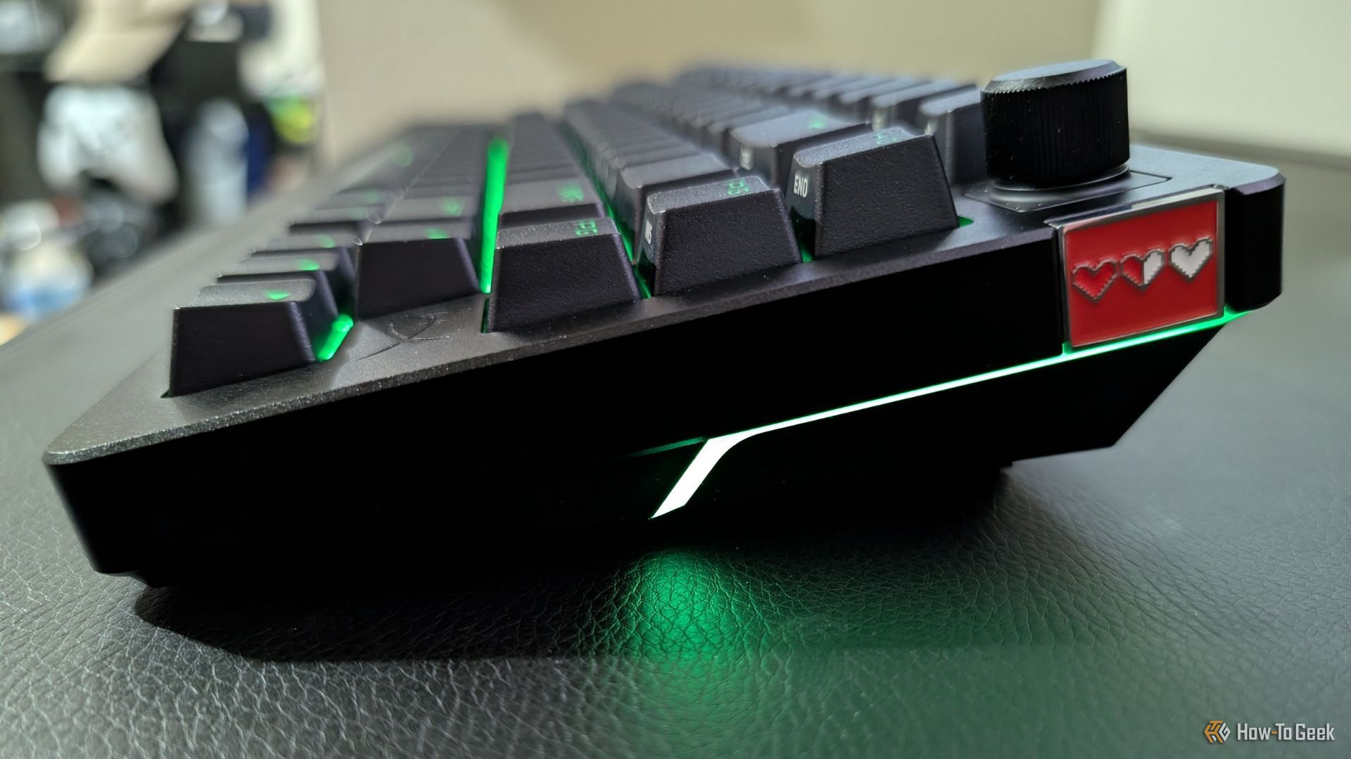 HyperX Alloy Rise 75 with green RGB backlighting and customizable badge.