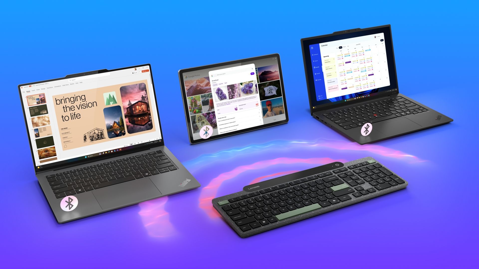 Lenovo's self-charging wireless keyboard, a Yoga tablet, and two ThinkPad laptops.