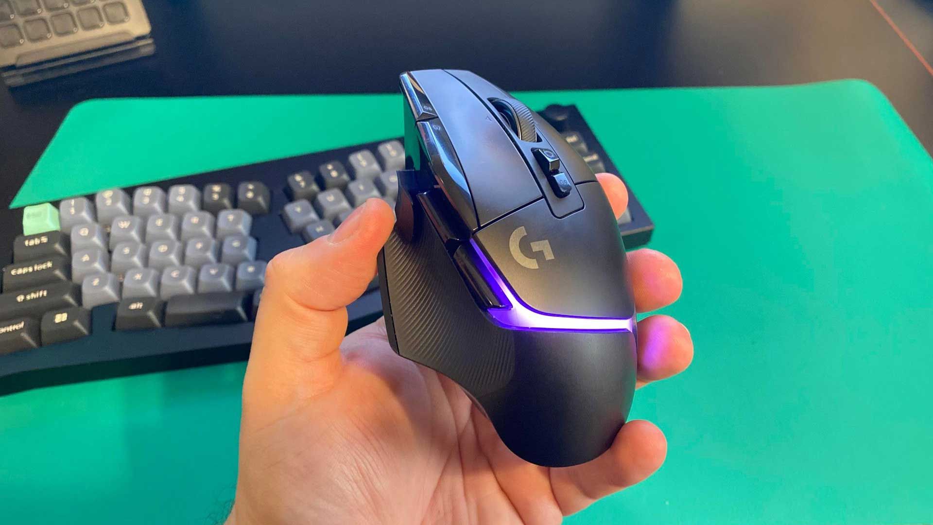 Logitech G502 X Plus mouse with purple lighting.