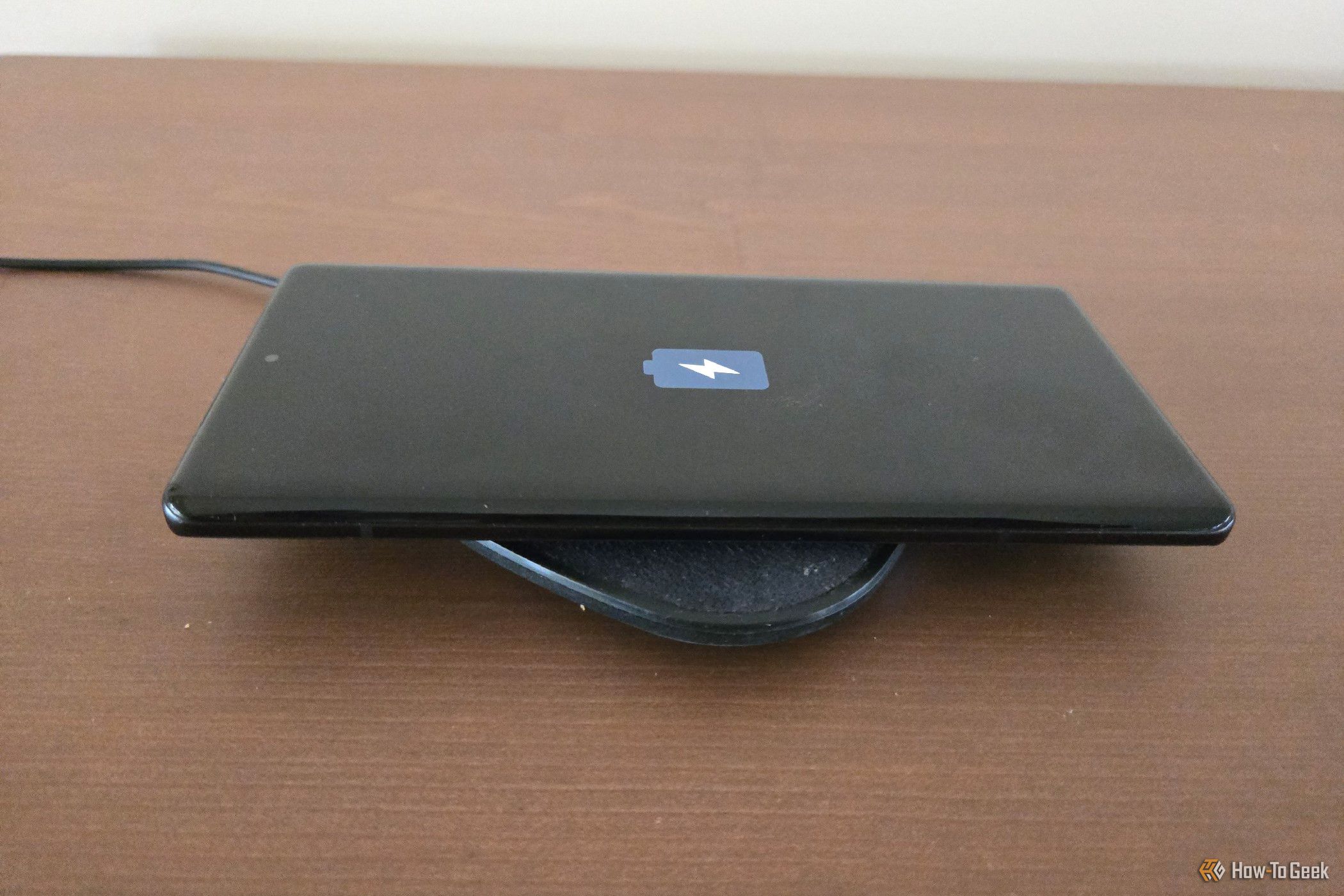 Motorola Edge Plus 2023 on a wireless charging pad.