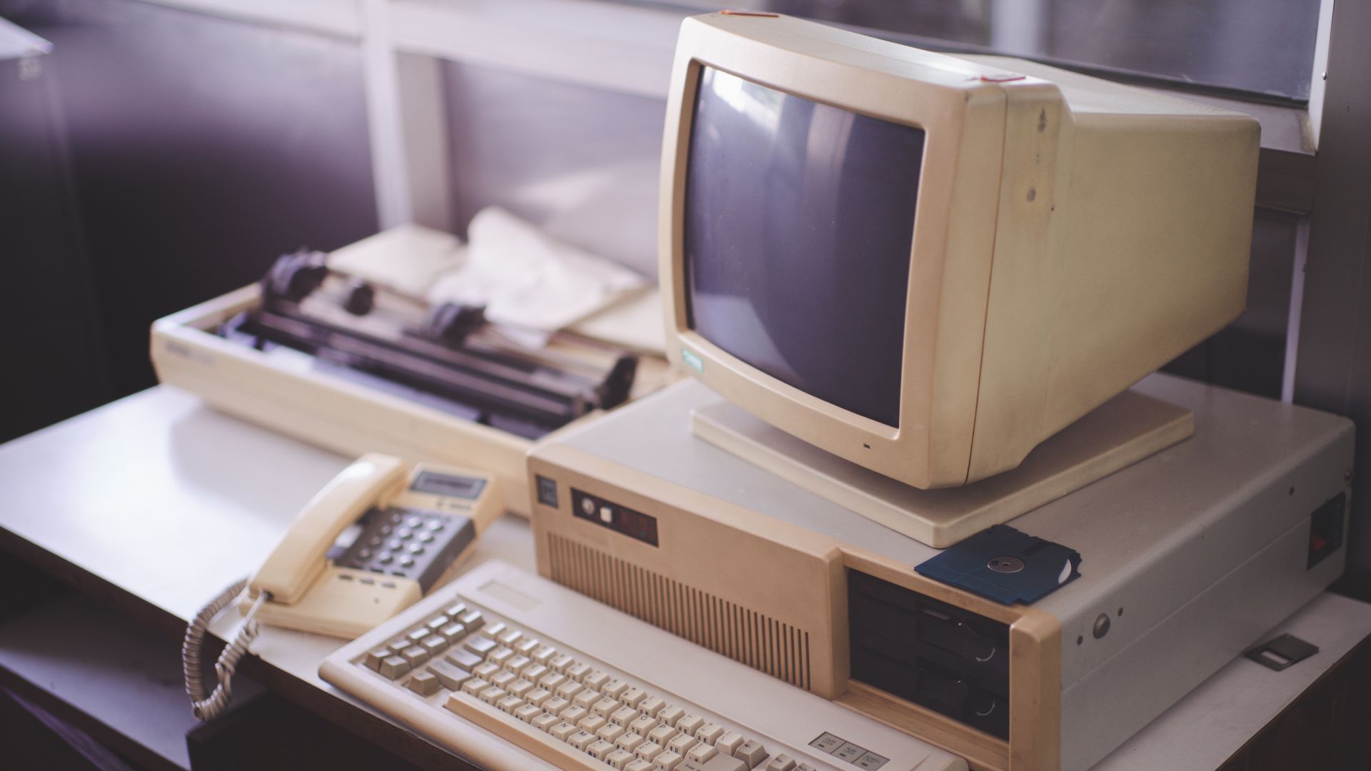 Old office and computer with obsolete technology.