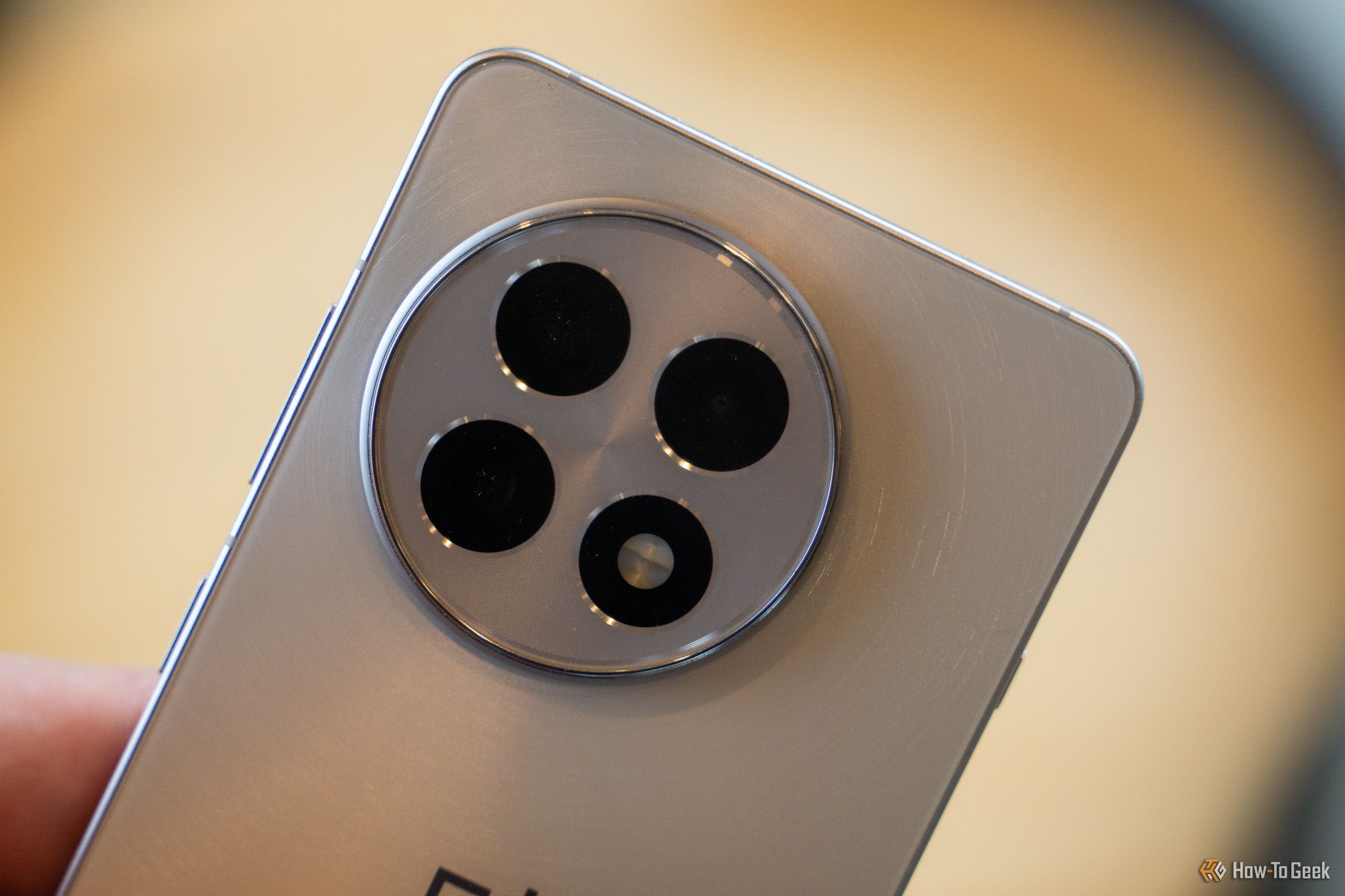 A close up of the triple camera array on the OnePlus 13R.