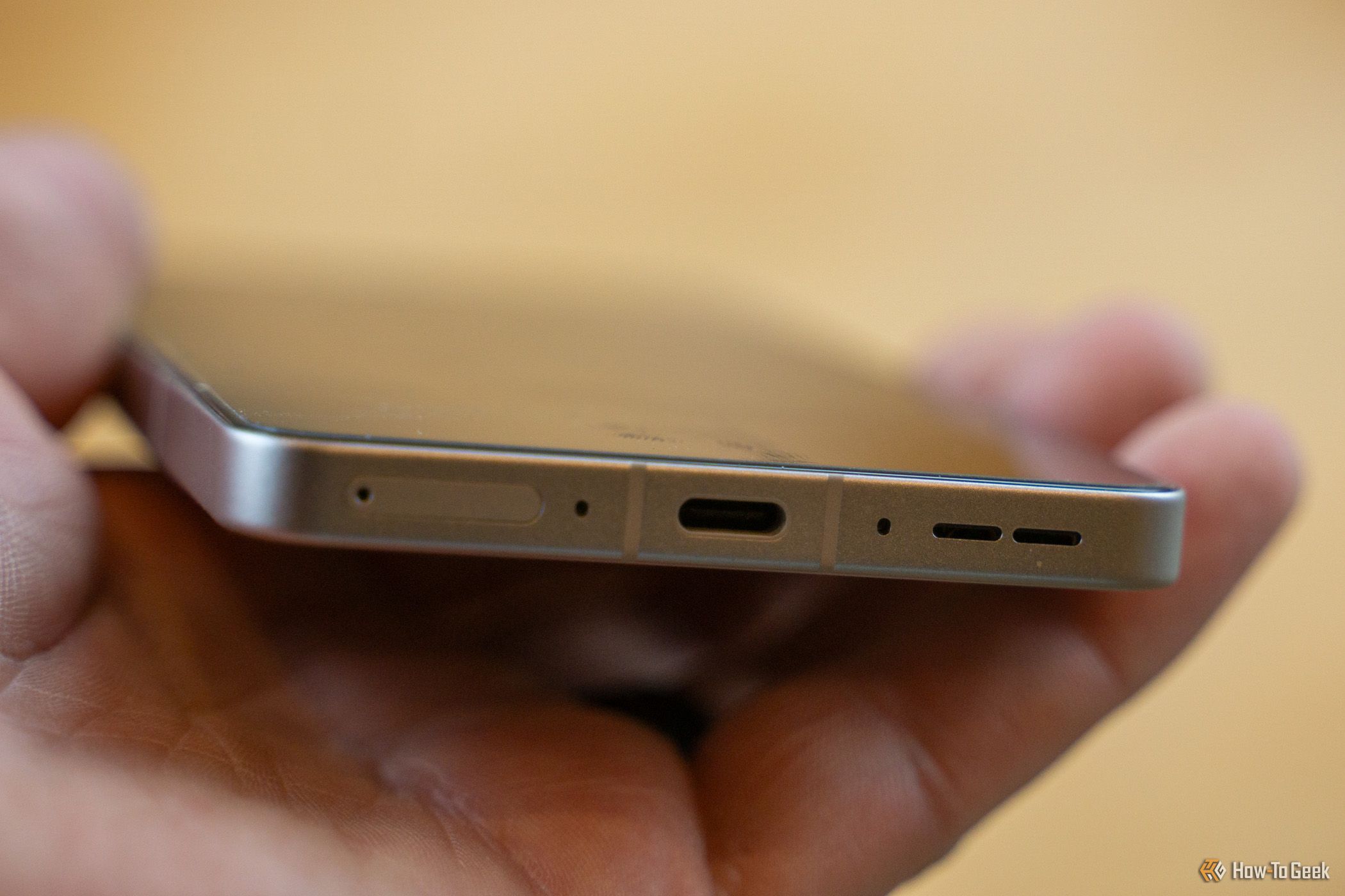 The USB-C charging port of the OnePlus 13R.