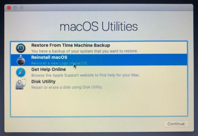 Reinstalling macOS using the macOS Utilities menu.