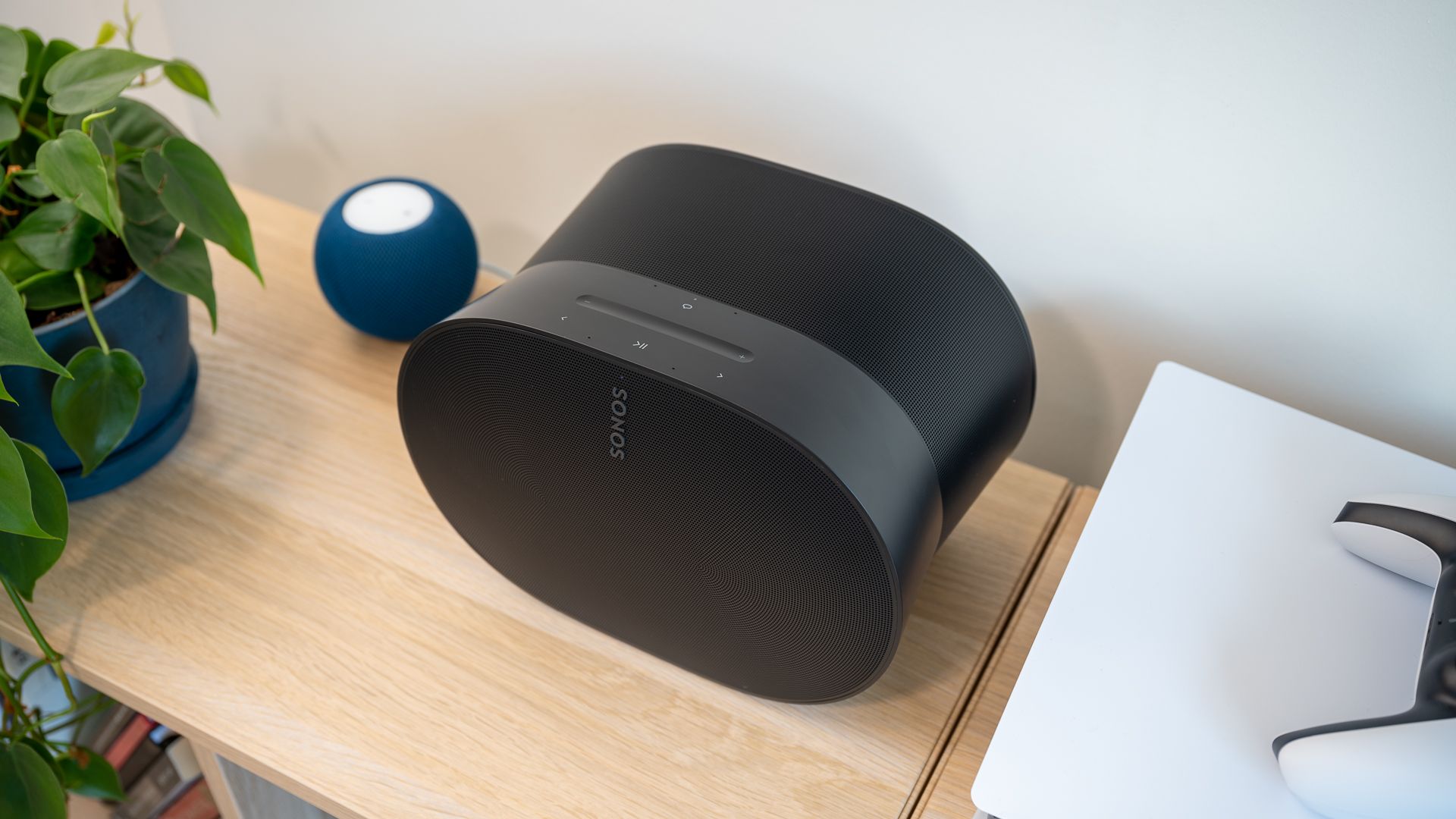 Two smart speakers on a shelf.