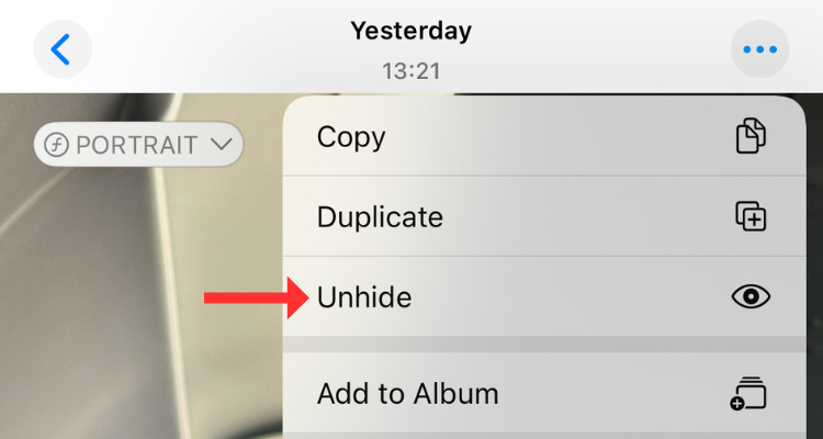 Screenshot of the Unhide button in the Hidden album on iPhone.