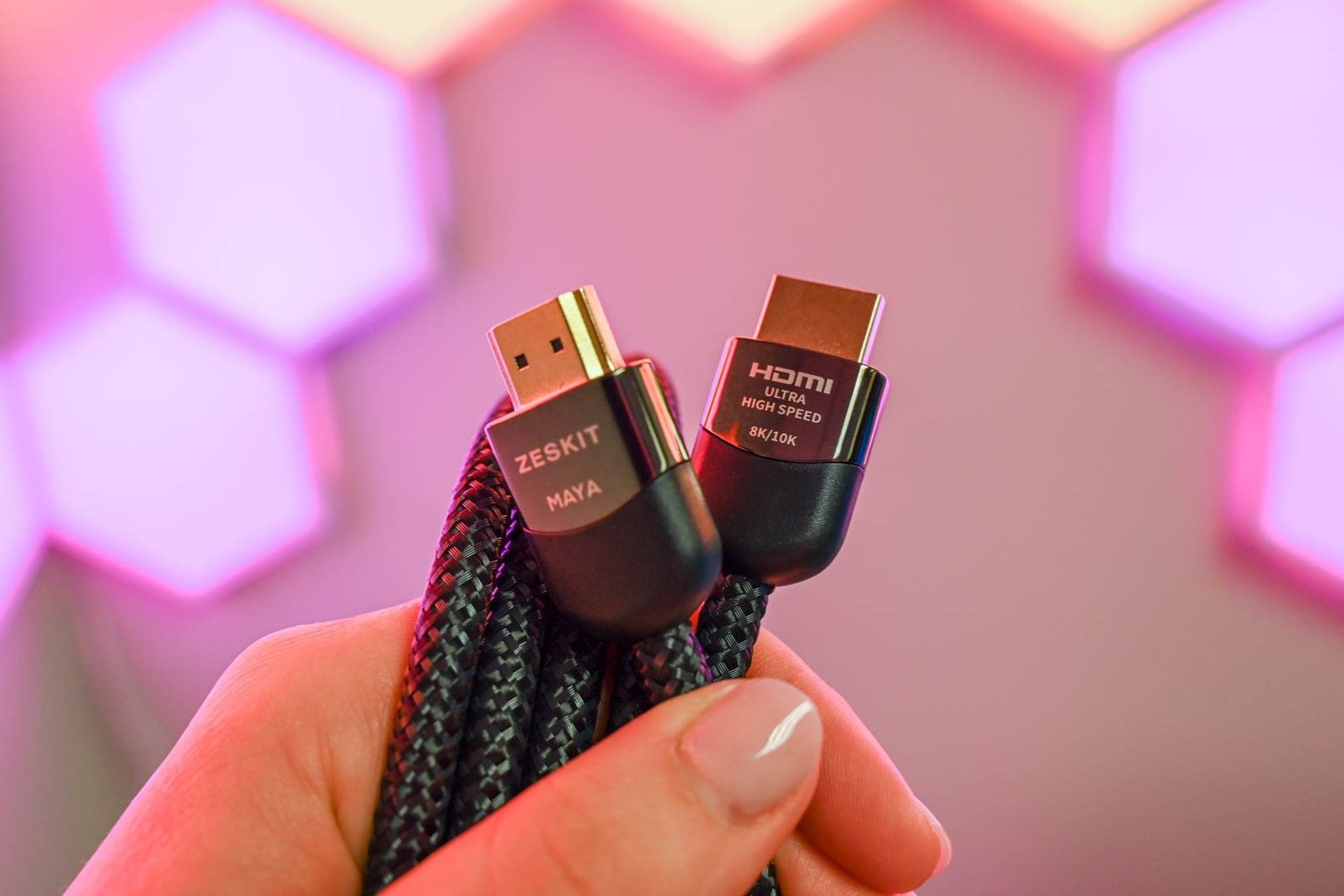 Person holding the Zeskit Maya Ultra High Speed HDMI Cable