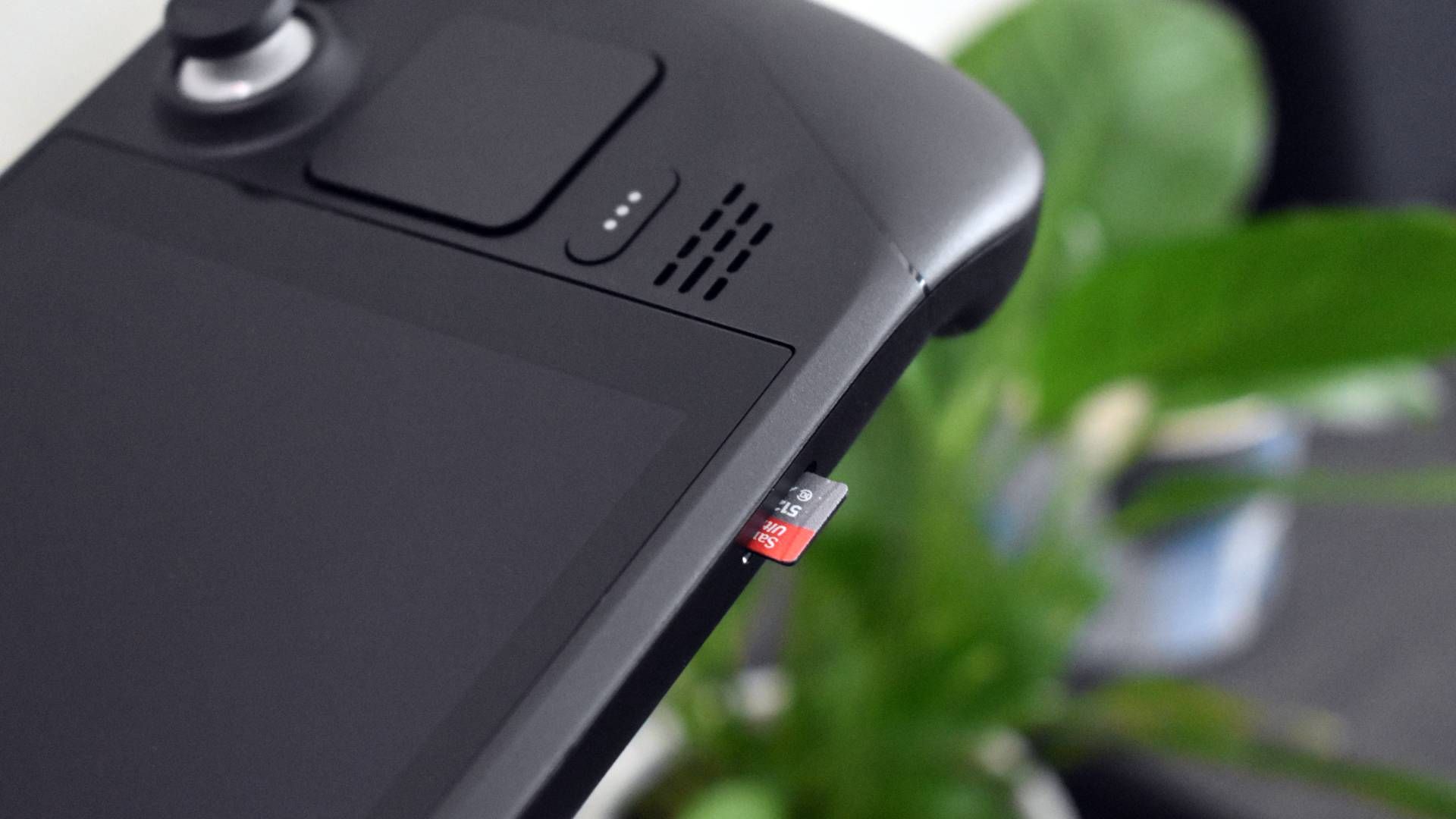 microSD card popping out of Steam Deck storage slot.