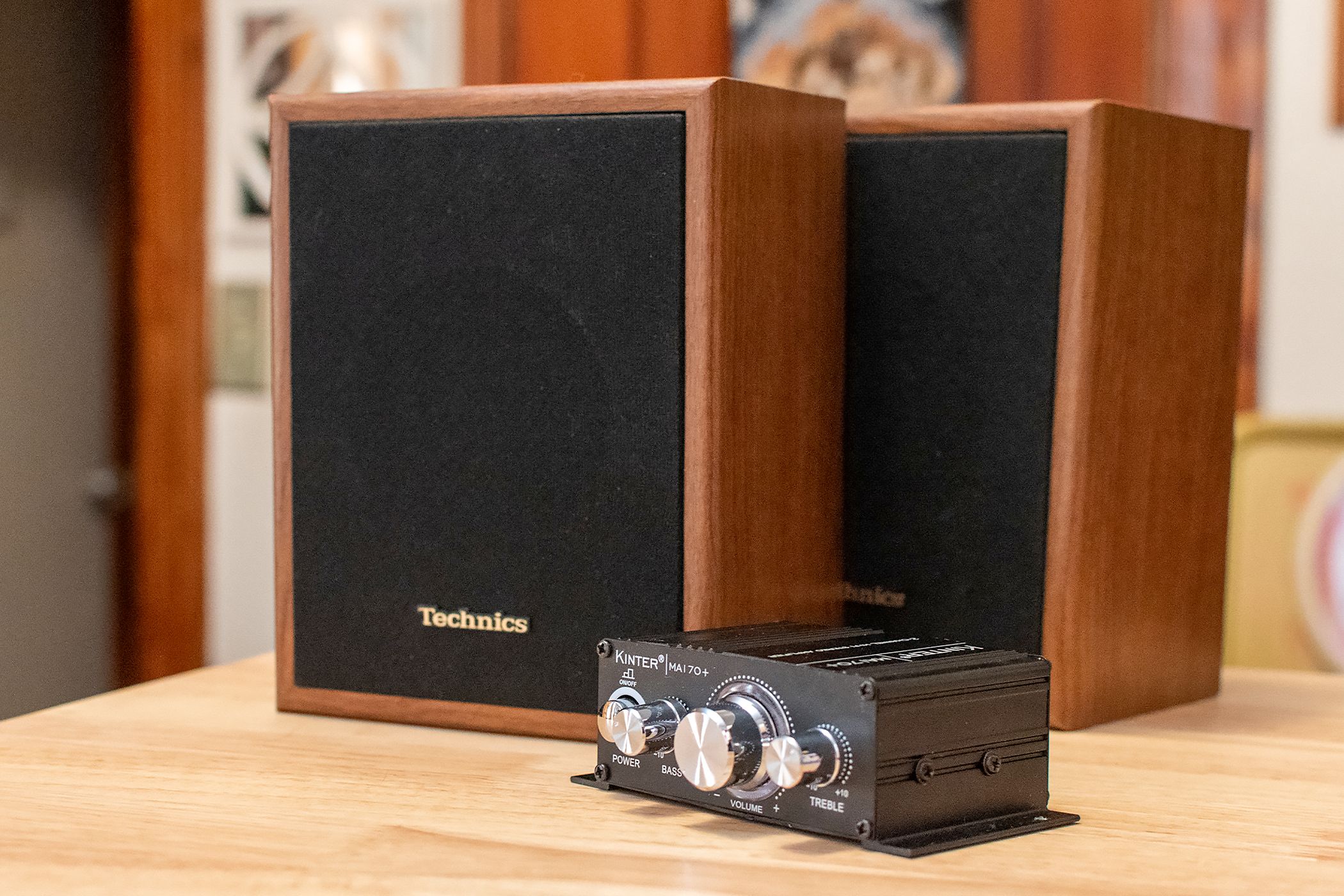 A small Kinter amplifier with a pair of Technics passive speakers.