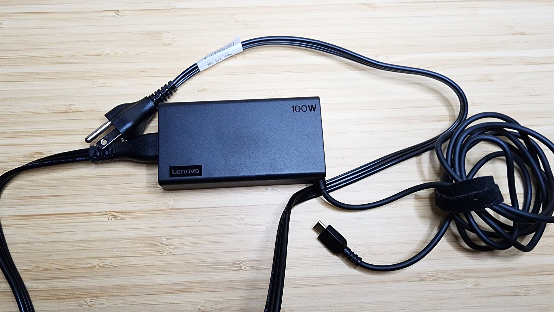 The Lenovo Yoga 9i Gen 8 laptop's 100-watt charger.