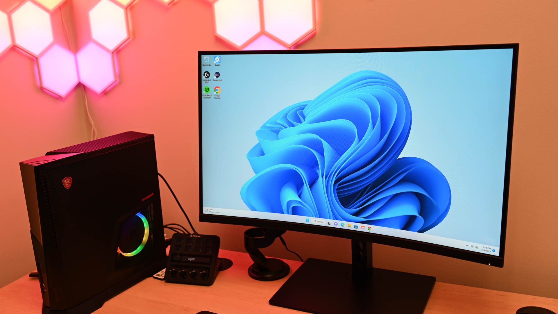 A Windows 11 computer placed on a table close to a speaker.