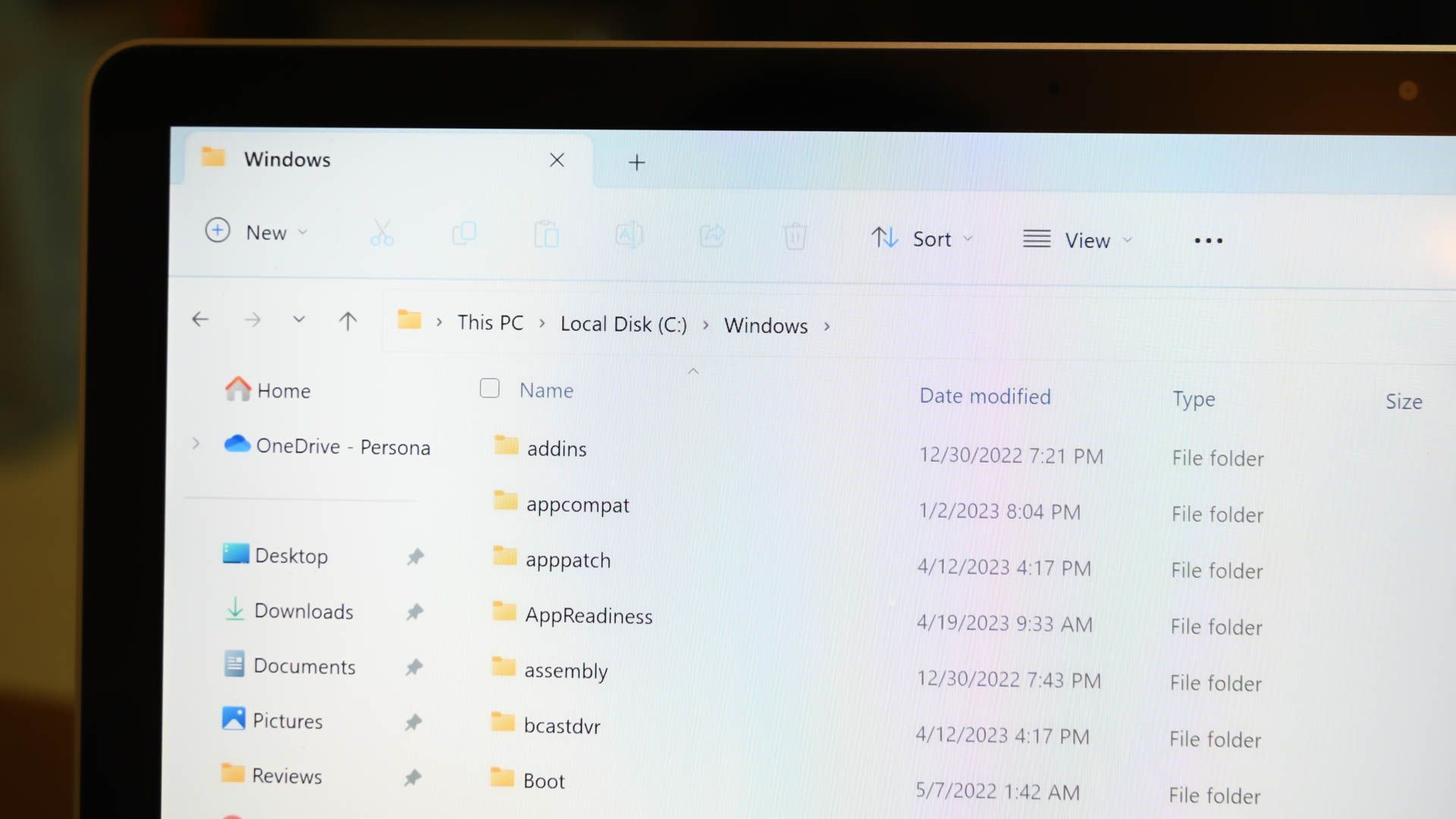 The Windows folder in the File Explorer app on a laptop screen.